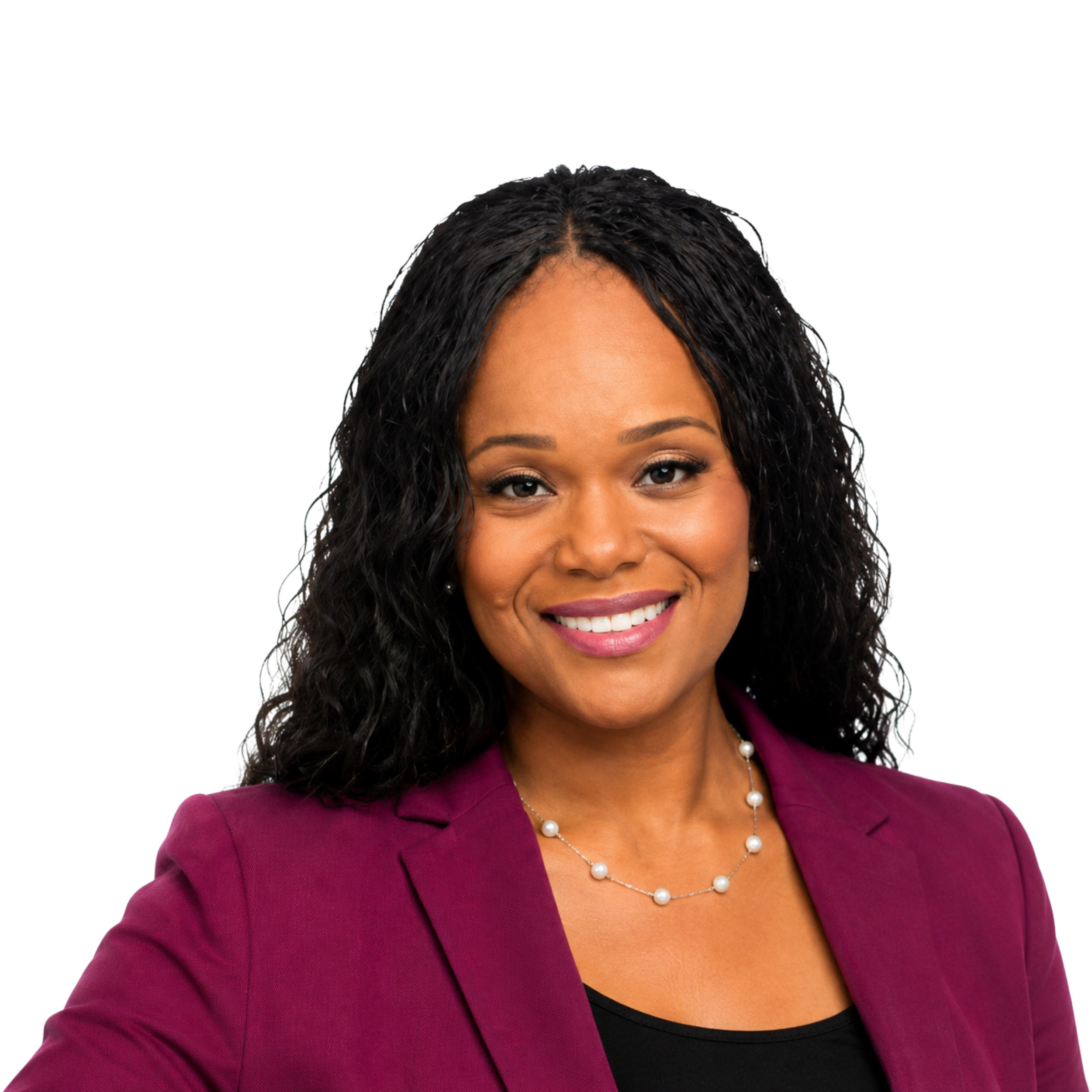 A woman with a warm smile, wearing a purple blazer, black top, pearl necklace, and pearl earrings, against a black background.