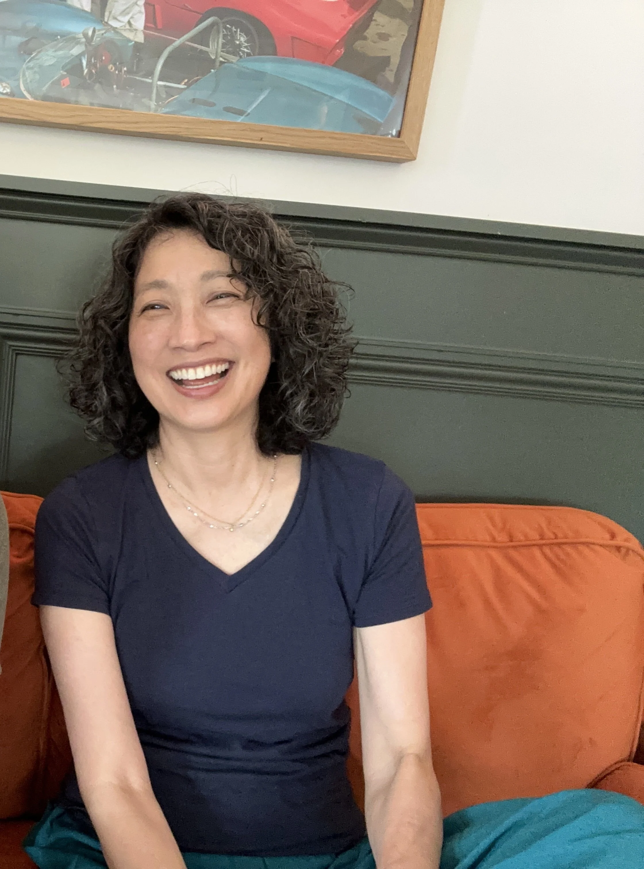 Erica Ando smiling during a conversation.