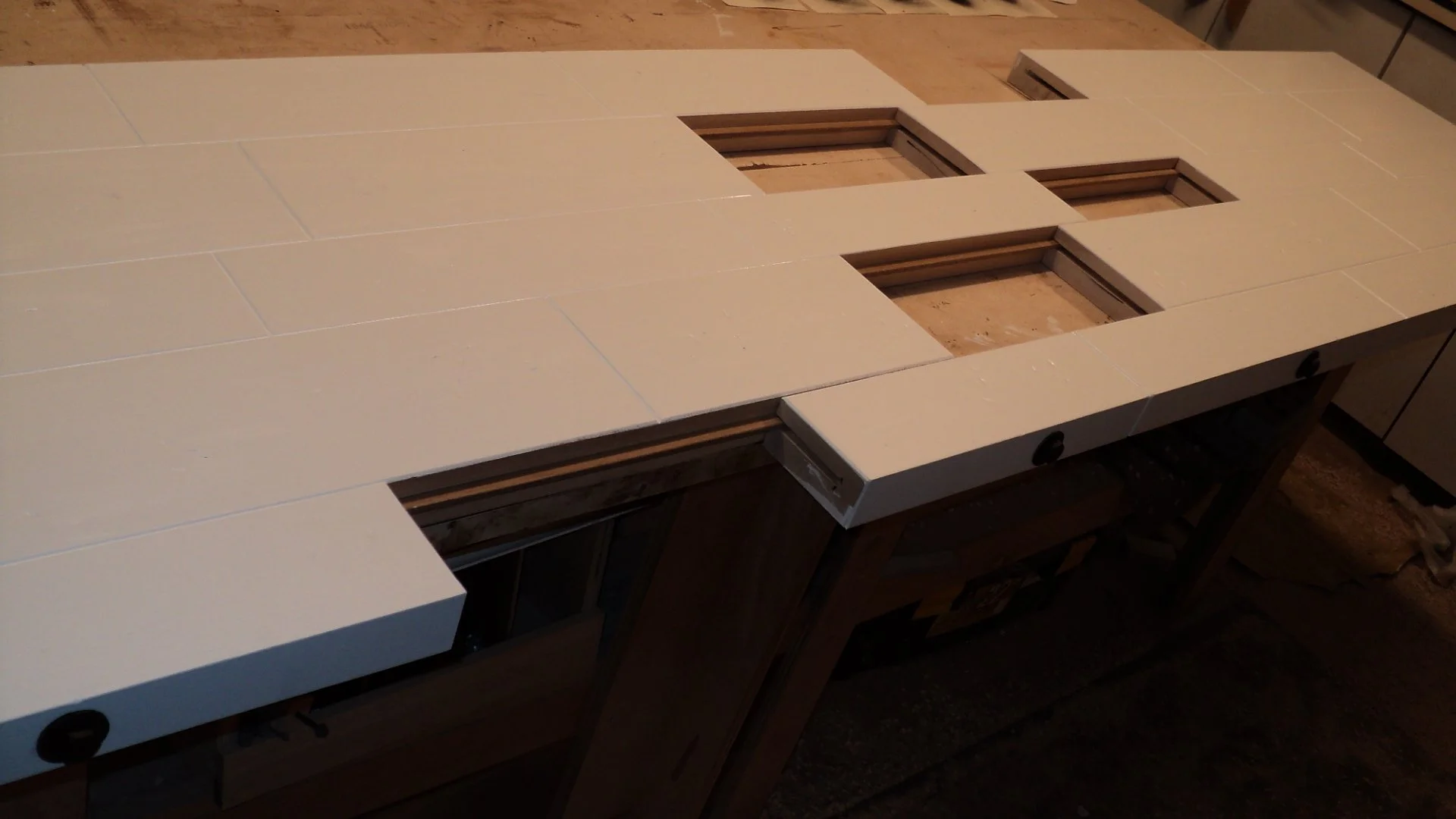 The material is glued, but in such a way that it can be separated for transport into an NYC apartment. You can see what I am talking about.