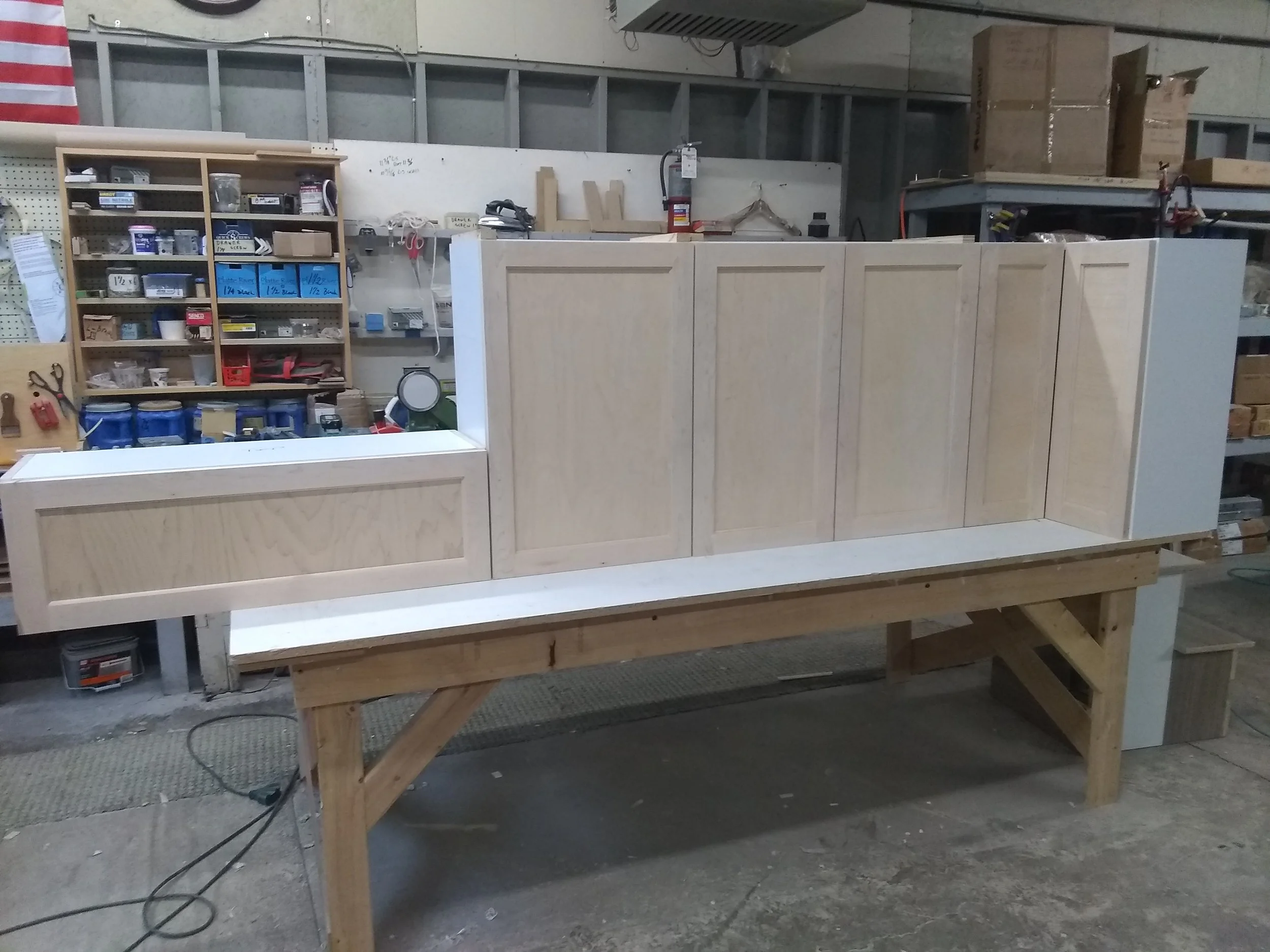 Custom-made solid maple  wall cabinets.
The furniture is always fully assembled prior to finishing to verify dimensions and all details.