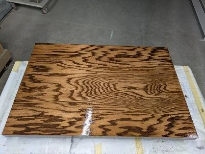 Book match veneer countertop. Two inches thick 3'x4' oak . Finished with english chestnut stain and satin varnish.