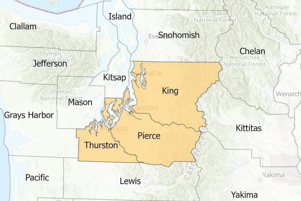 Map of the Seattle metropolitan area with counties labeled, highlighted in beige, including King, Pierce, and Thurston counties.