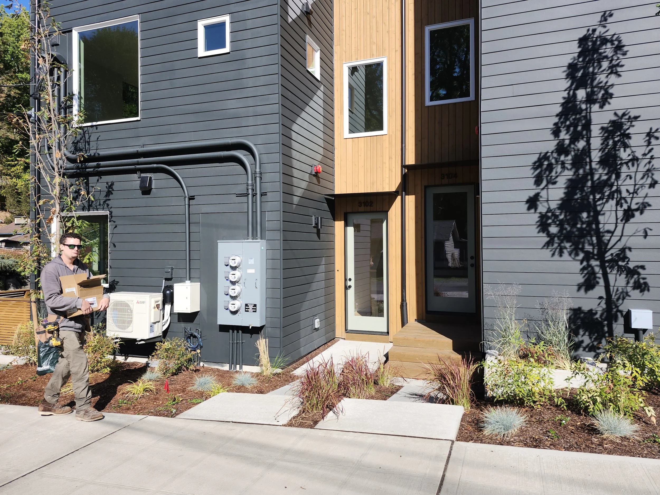 Exterior lighting installation for newly constructed townhomes.