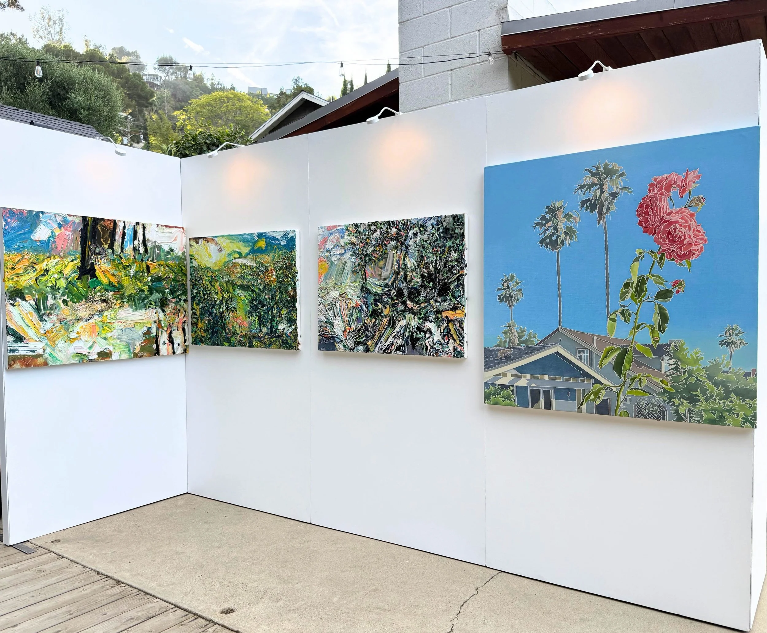 Left to right: Paintings by Mario Joyce and Adam de Boer