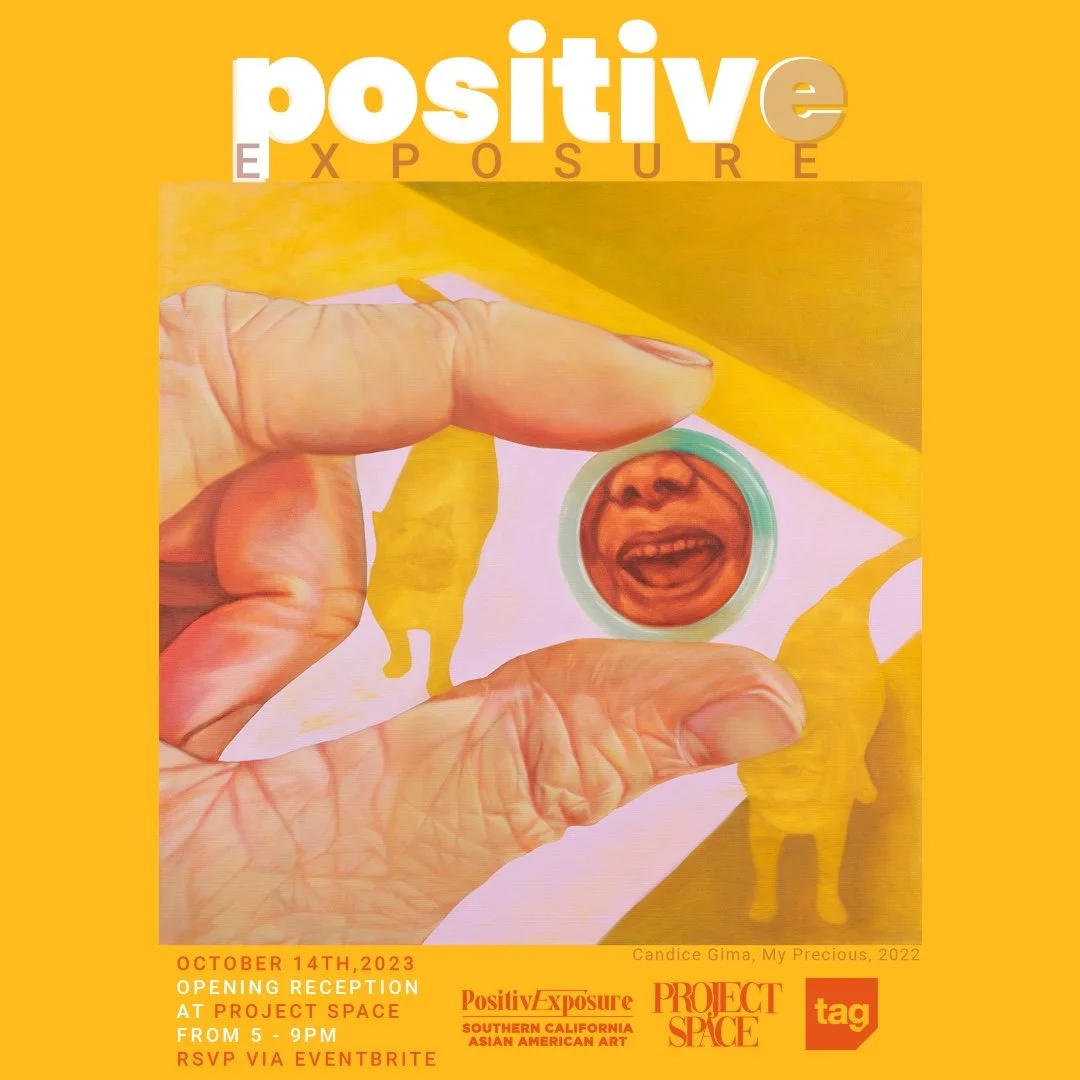 A promotional poster featuring a hand holding a Chinese coin with a laughing child's face on it. The background is bright yellow with text about an art exhibit called Positive Exposure, opening October 14, 2023, at Project Space.
