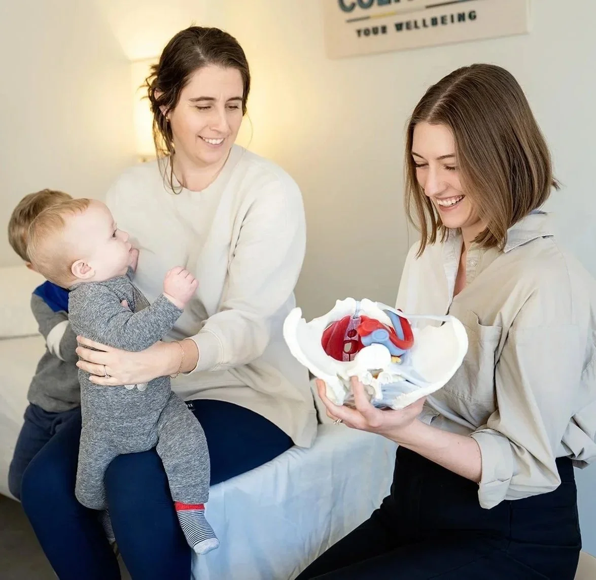 Cultivate Your Wellbeing therapist educating patient on csection and pelvic floor recovery.
