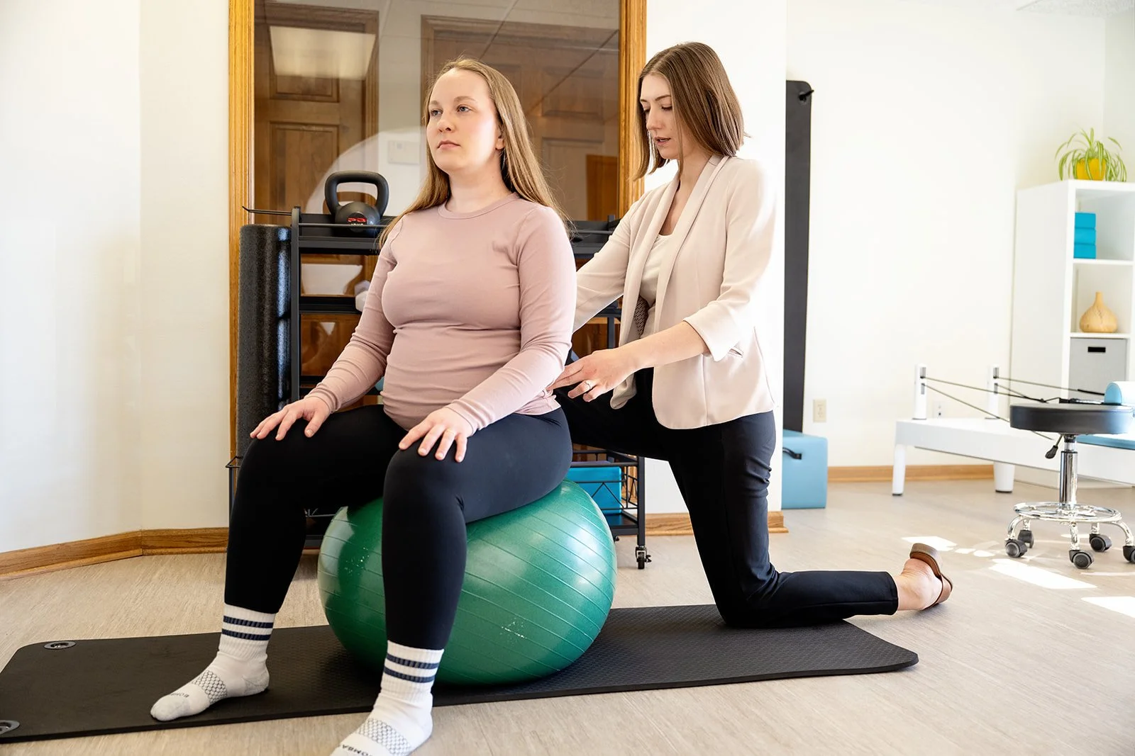 Pregnant patient receiving birth preparation and pelvic floor physical therapy at Cultivate Your Wellbeing, serving Mequon and Brookfield, Wisconsin.