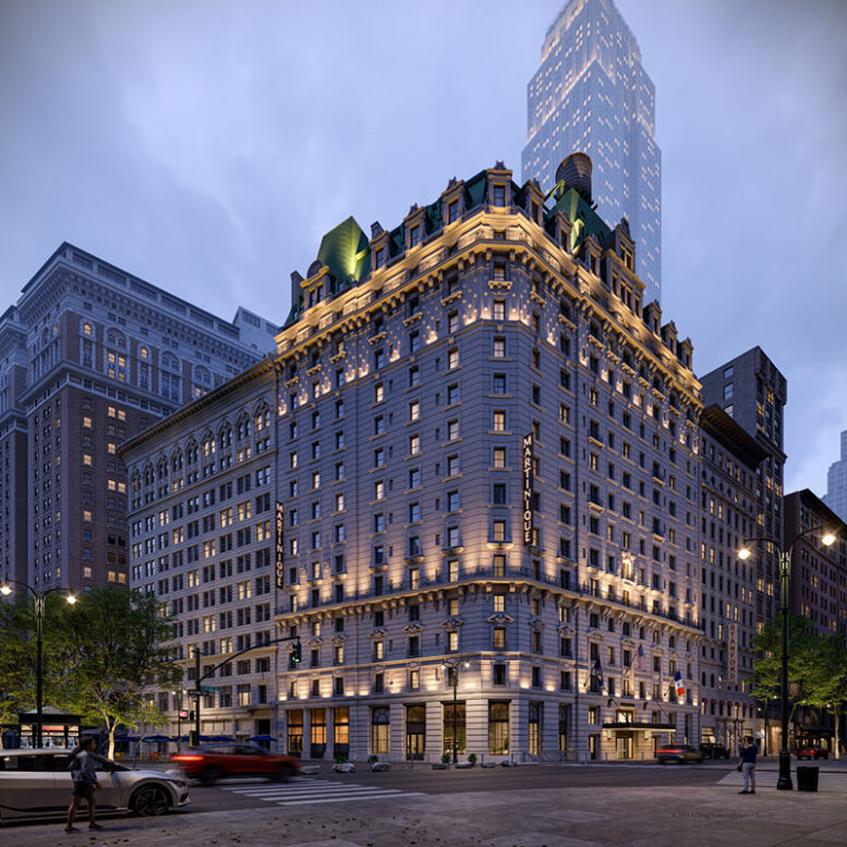 Night view of a historic building with ornate architecture illuminated by exterior lights in an urban setting, with a tall modern skyscraper in the background and cars on the street.