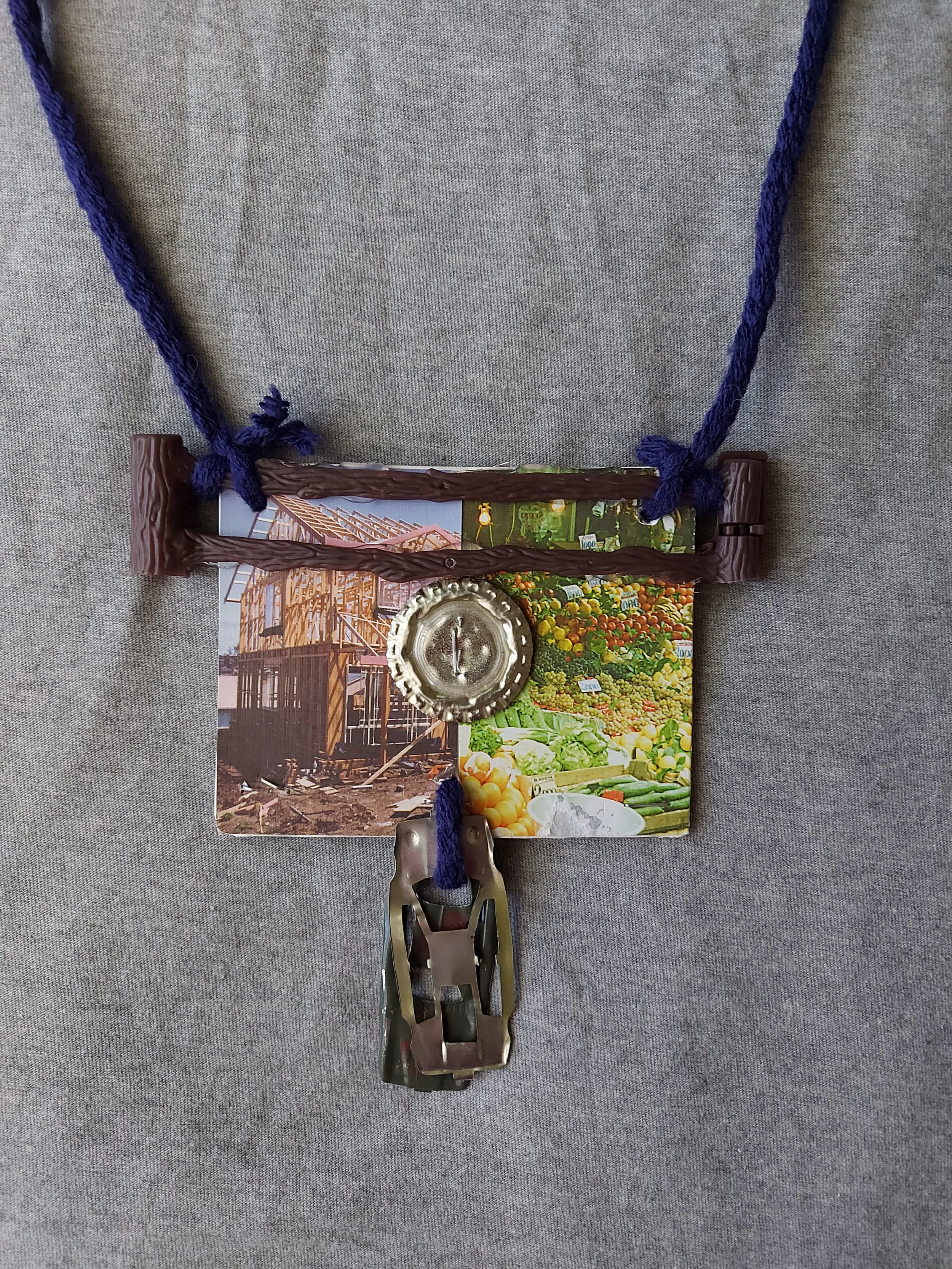 'Maybe nows not the time for talking' - 
Found object two sided necklace.
Metal, card, plastic, yarn.
