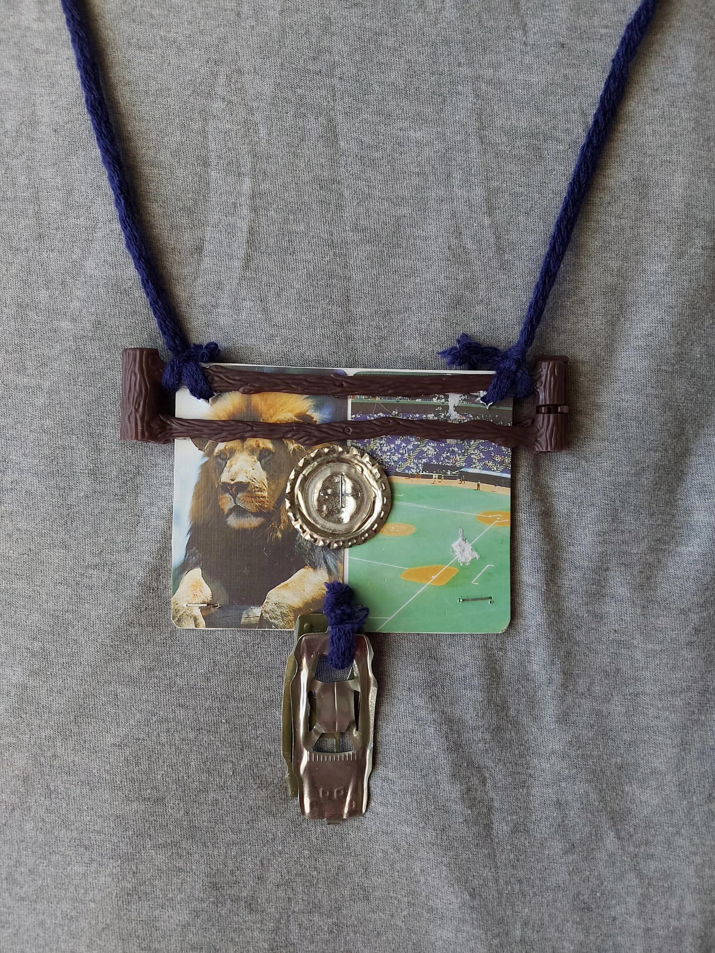 'Maybe nows not the time for talking' - 
Found object two sided necklace.
Metal, card, plastic, yarn.