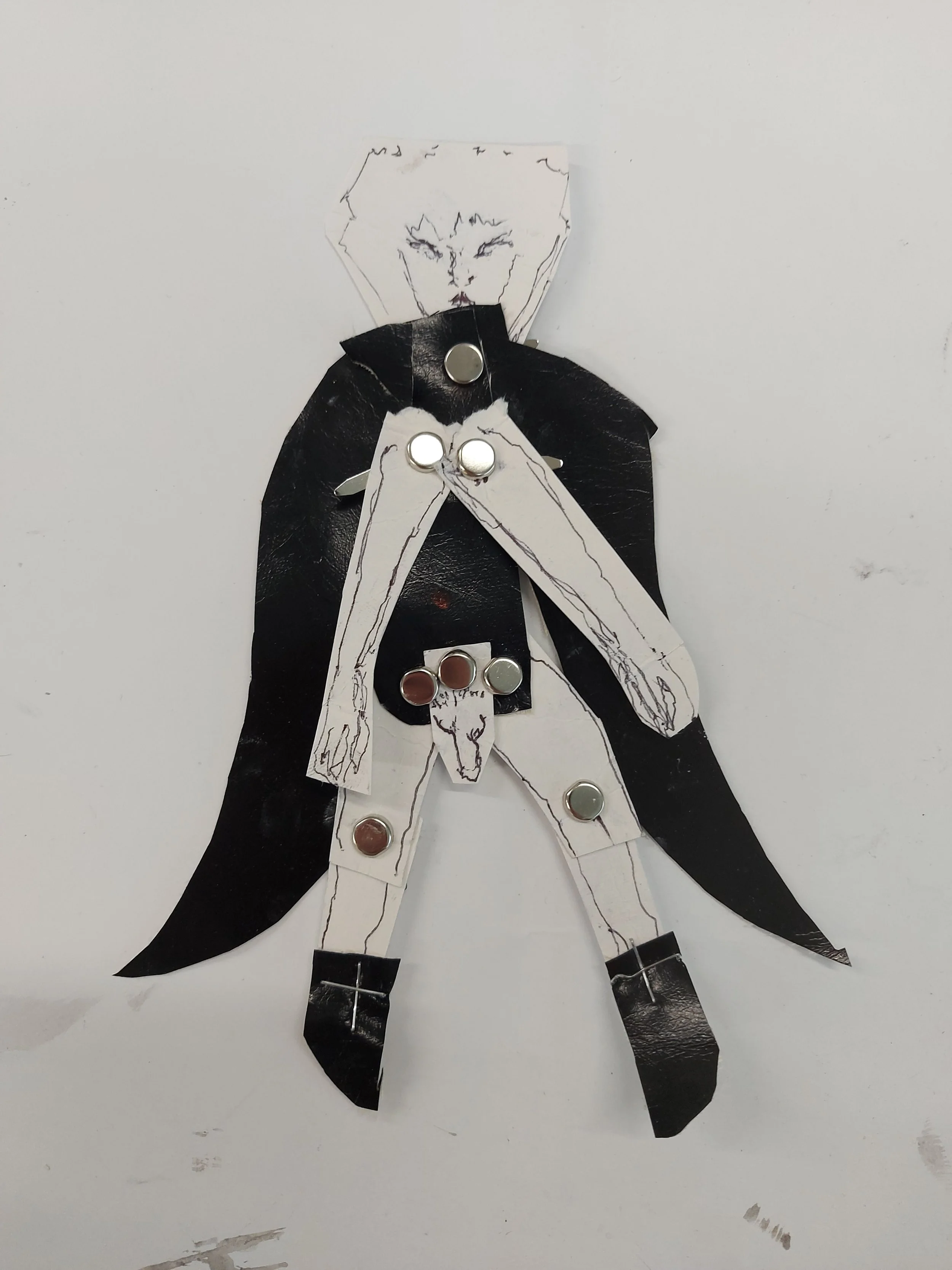 'Boy in Cape' - 
Pleather, Paper, Staples and Pen on Paper