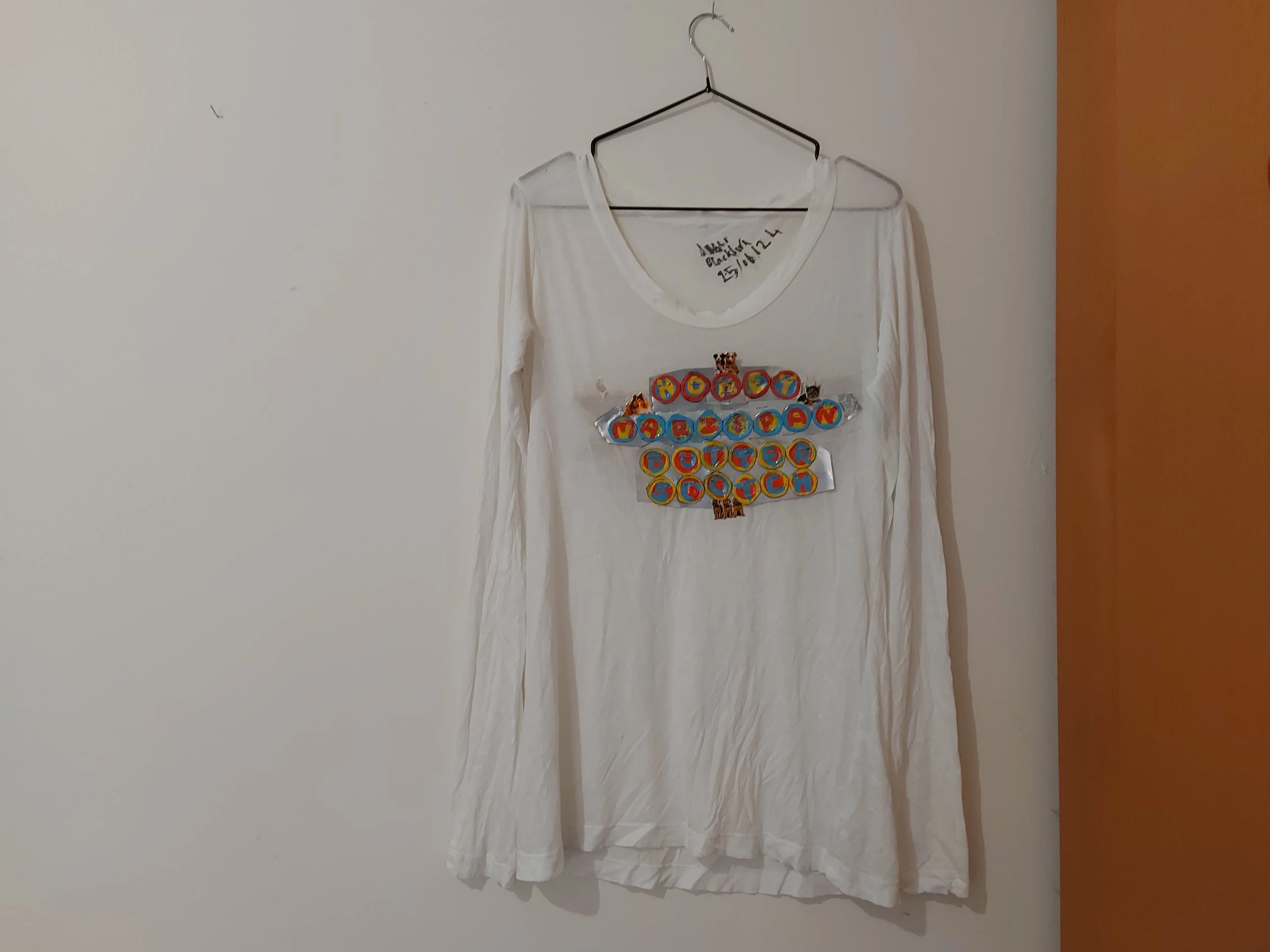 'Metal Graphic: Honey - Marzipan - Butterscotch' - 
Marker, Nail Polish, Bottle Caps, Tin, Found Wood, Stickers on Cotton T-shirt