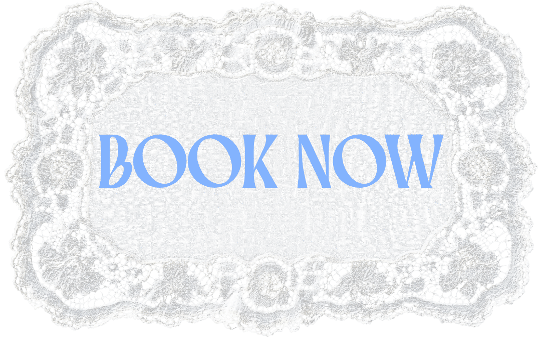 A lace doily with the words 'BOOK NOW' written in large, light blue letters in the center.