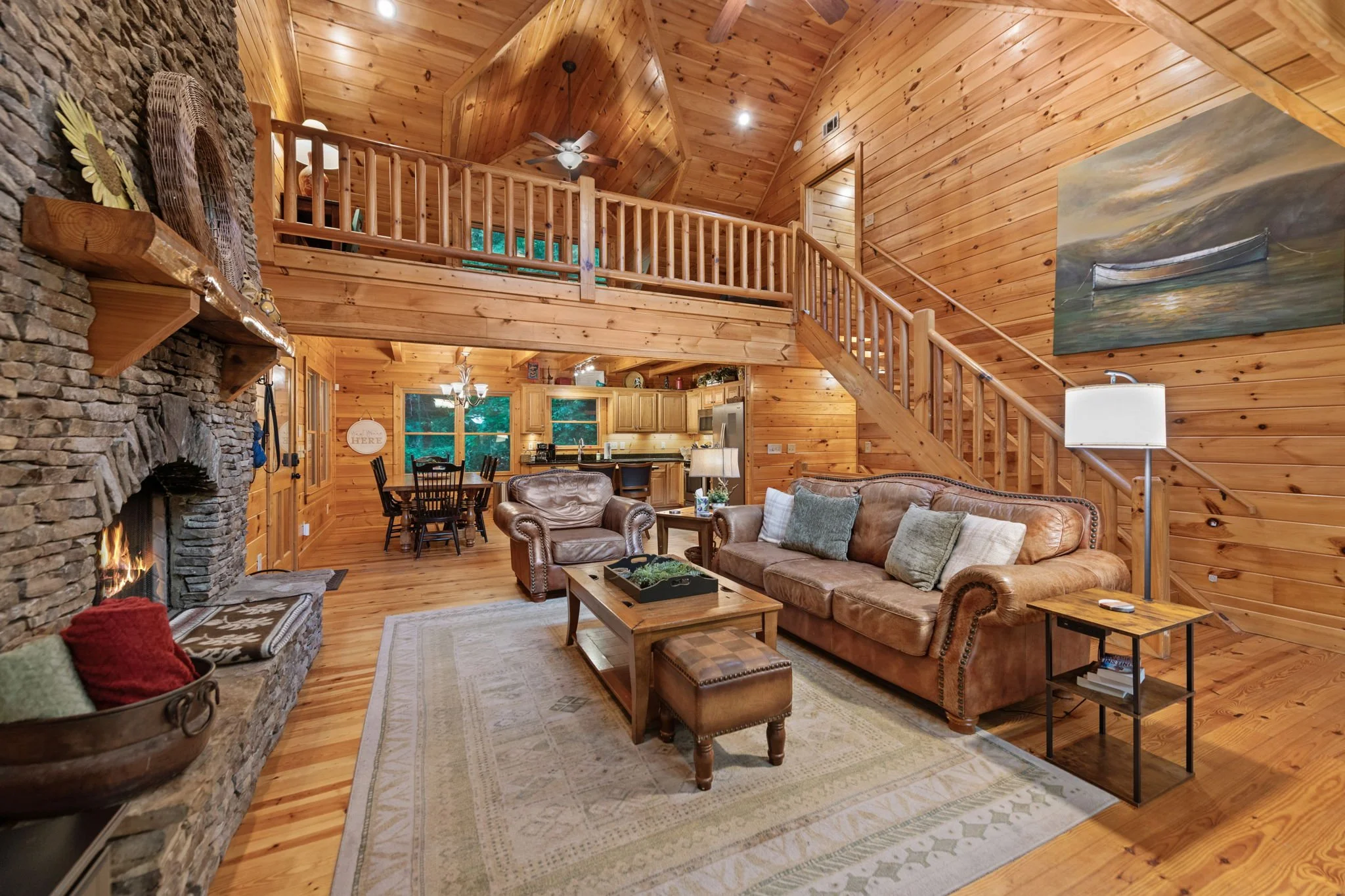 Great room with stone fireplace in an Ellijay, GA cabin