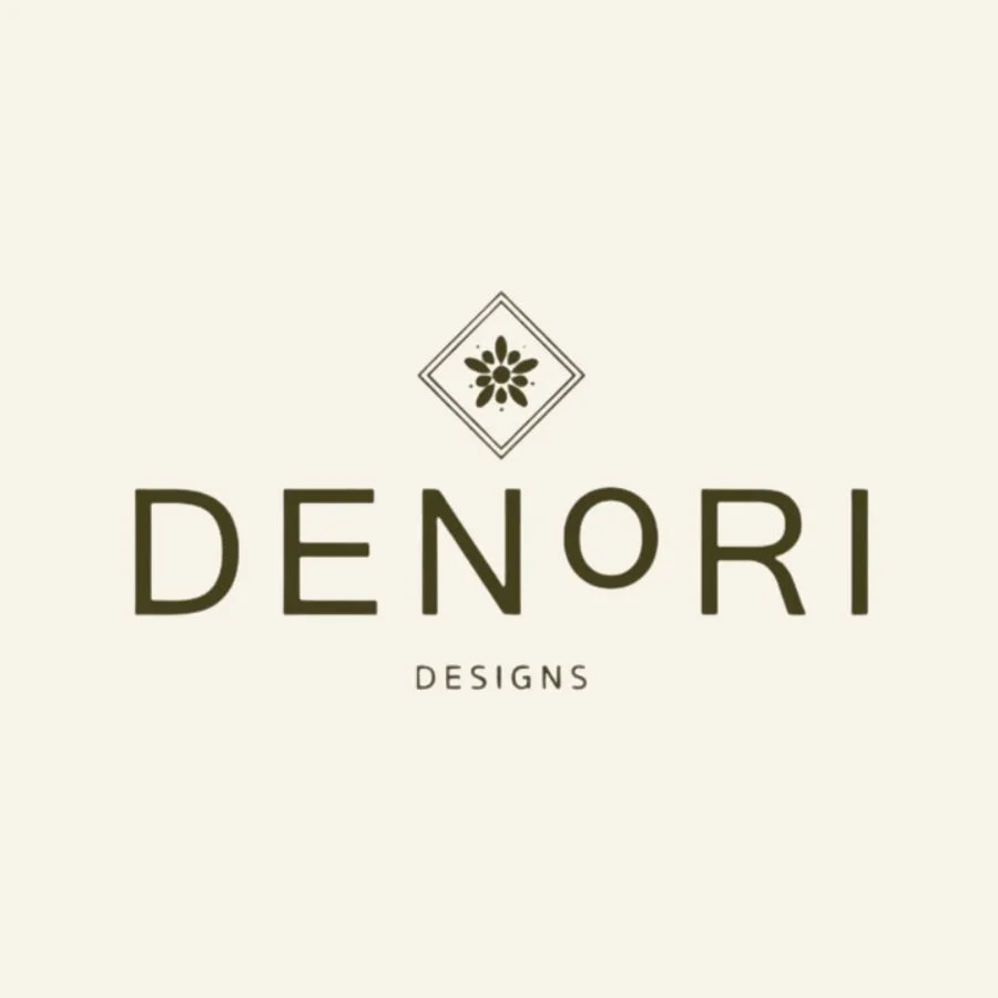 Logo for Denori Designs featuring a flower icon above the brand name in bold font, on a light background.