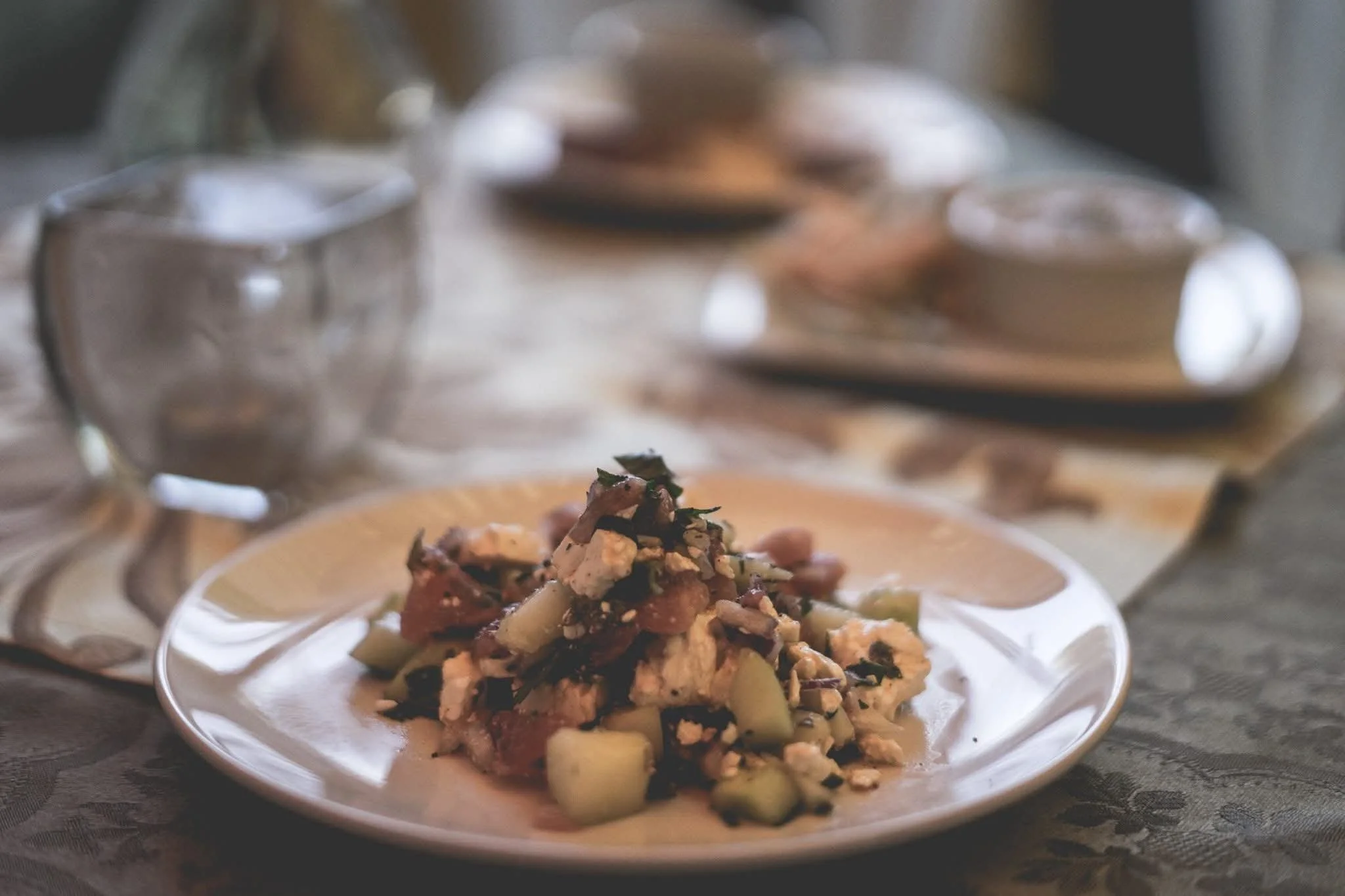Mediterranean-style salad with feta, cucumber, and herbs served at Moroccan Night pop-up dinner.