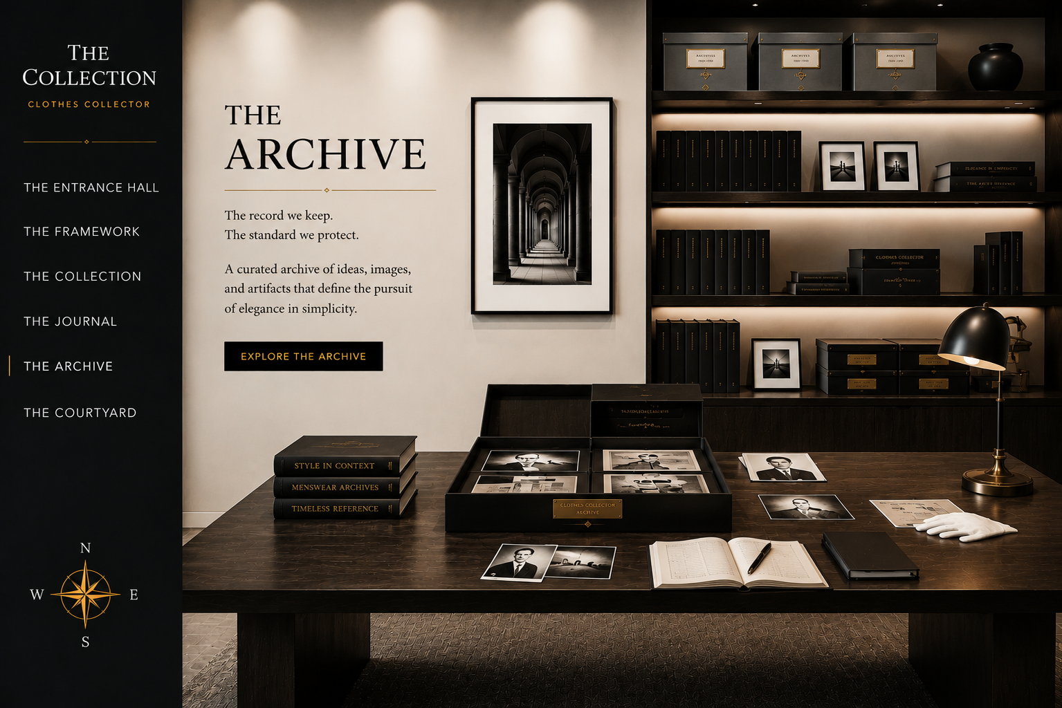 An archival display room with a wooden table holding black and white photographs, books, and a black desk lamp. The background features shelves with black boxes and framed photographs. The left side has a black vertical panel with white and gold text describing 'The Archive' at a clothes collector's exhibit.