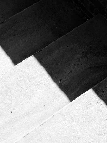 Close-up view of black and white steps or stairs.