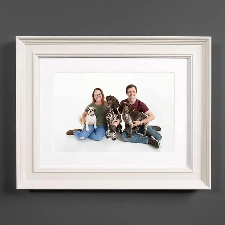 Classic framed family portrait in a cream frame
