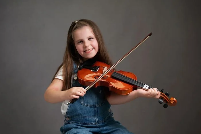 Girl playing her violin