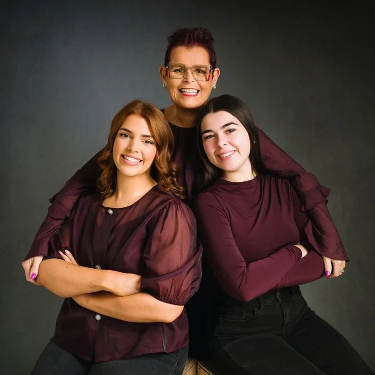 Three generations in deep plum on grey