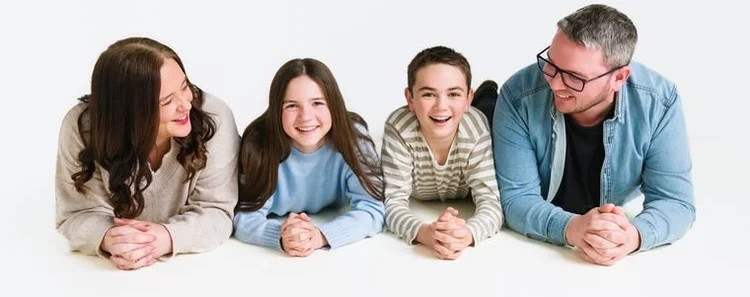 Family of four in soft neutrals