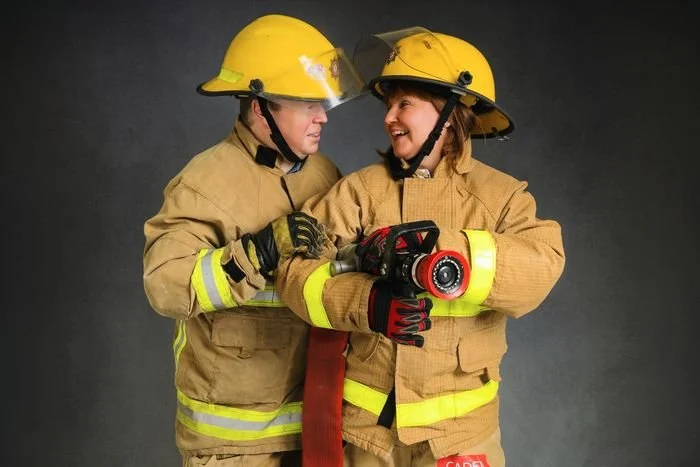 Couple photographed in fire service kit
