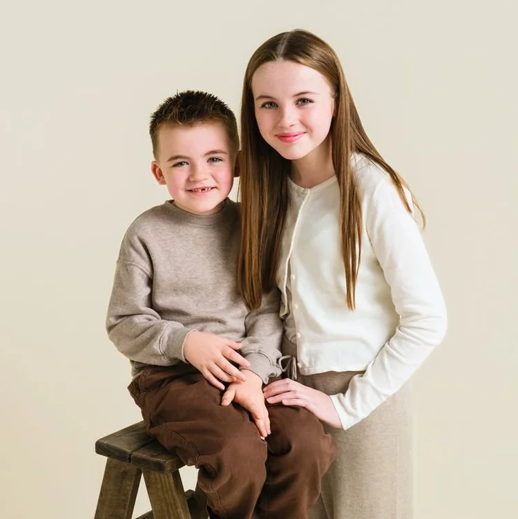 Brother and sister in cream and brown