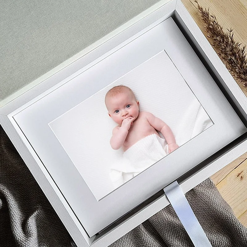 Folio portrait box with a mounted newborn print