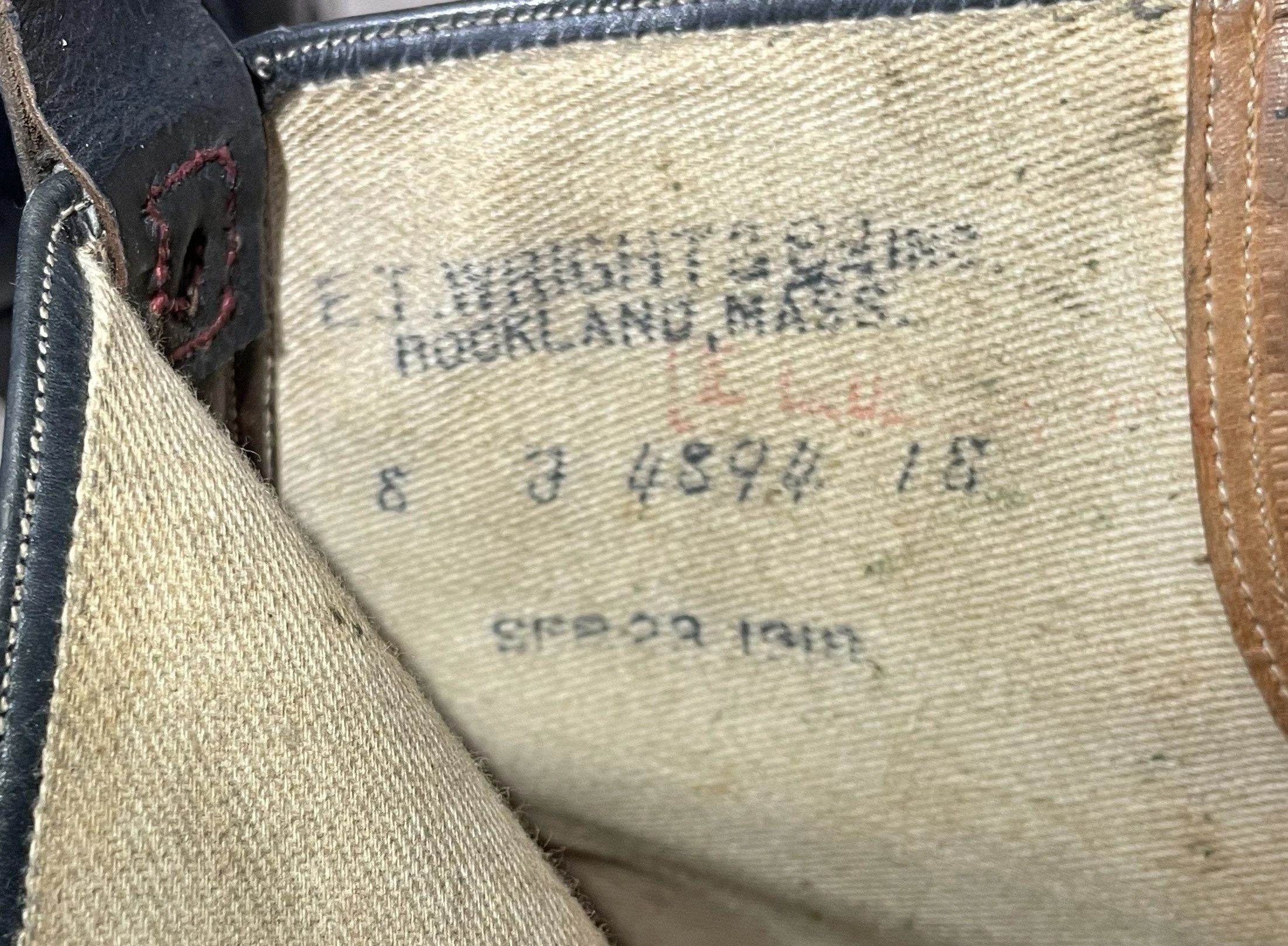 Interior lining stamp of the E. T. Wright U.S. Navy boot, showing the maker, size, and contract/manufacturing markings.