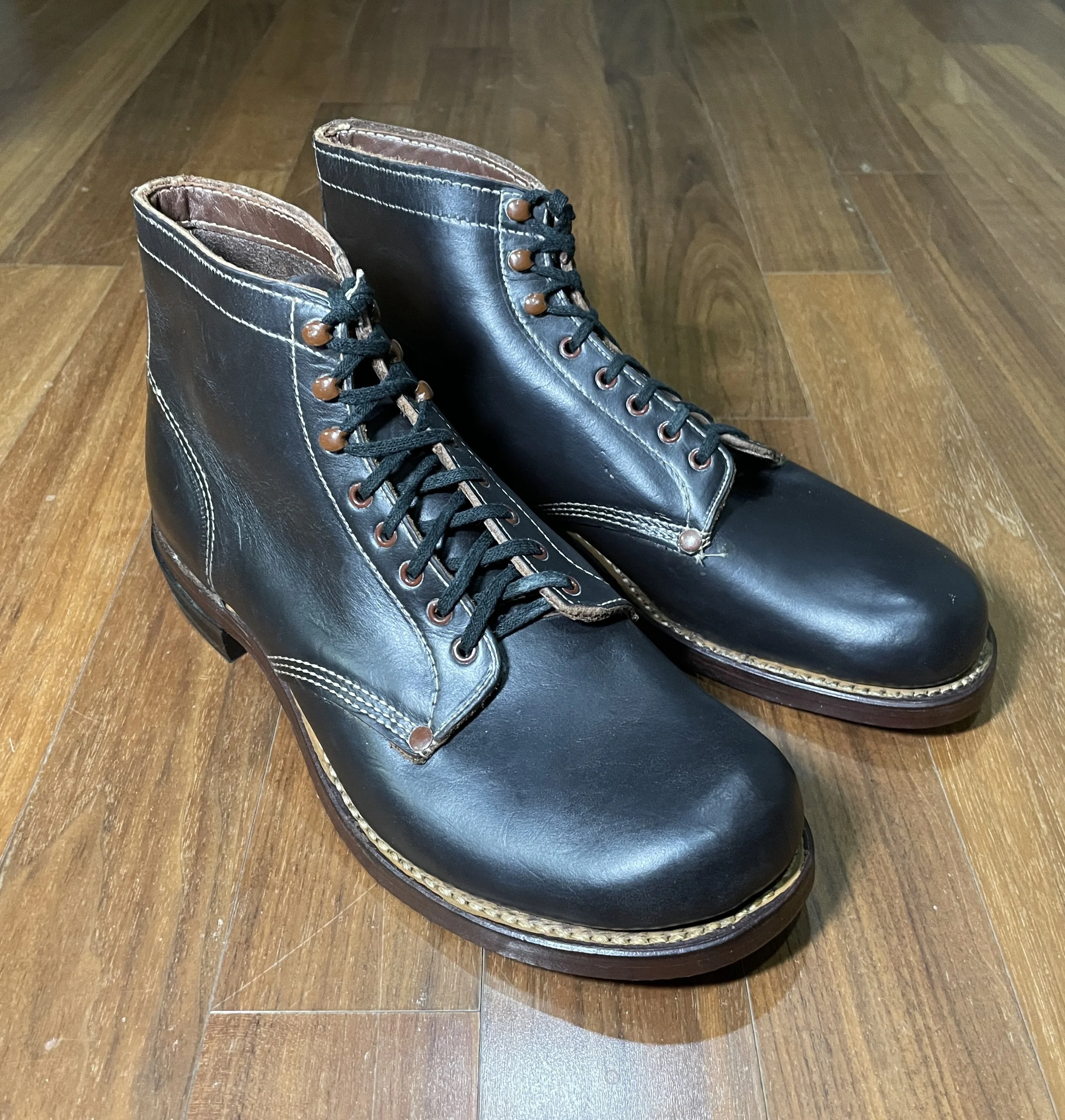 Unknown maker leather-sole work boots, c. 1930s–1940s. A plain and utilitarian pair, similar in character to the other unknown work boots in the archive, showing riveted quarters, contrast stitching, and straightforward period work-boot construction.