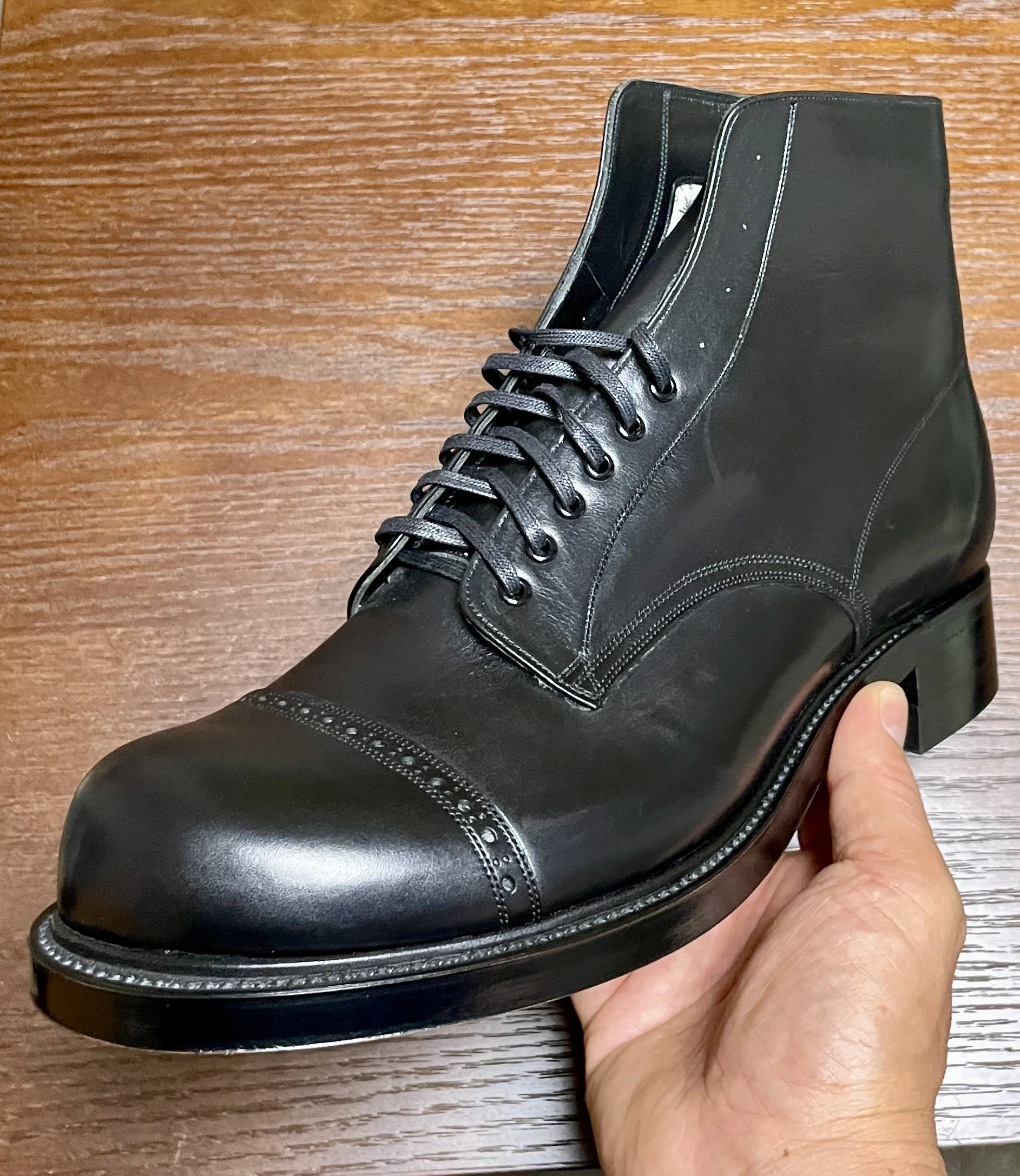 Close-up of the Rustroops Product No. 1 prototype, showing the vamp, cap toe, eyelet layout, and upper construction details.
