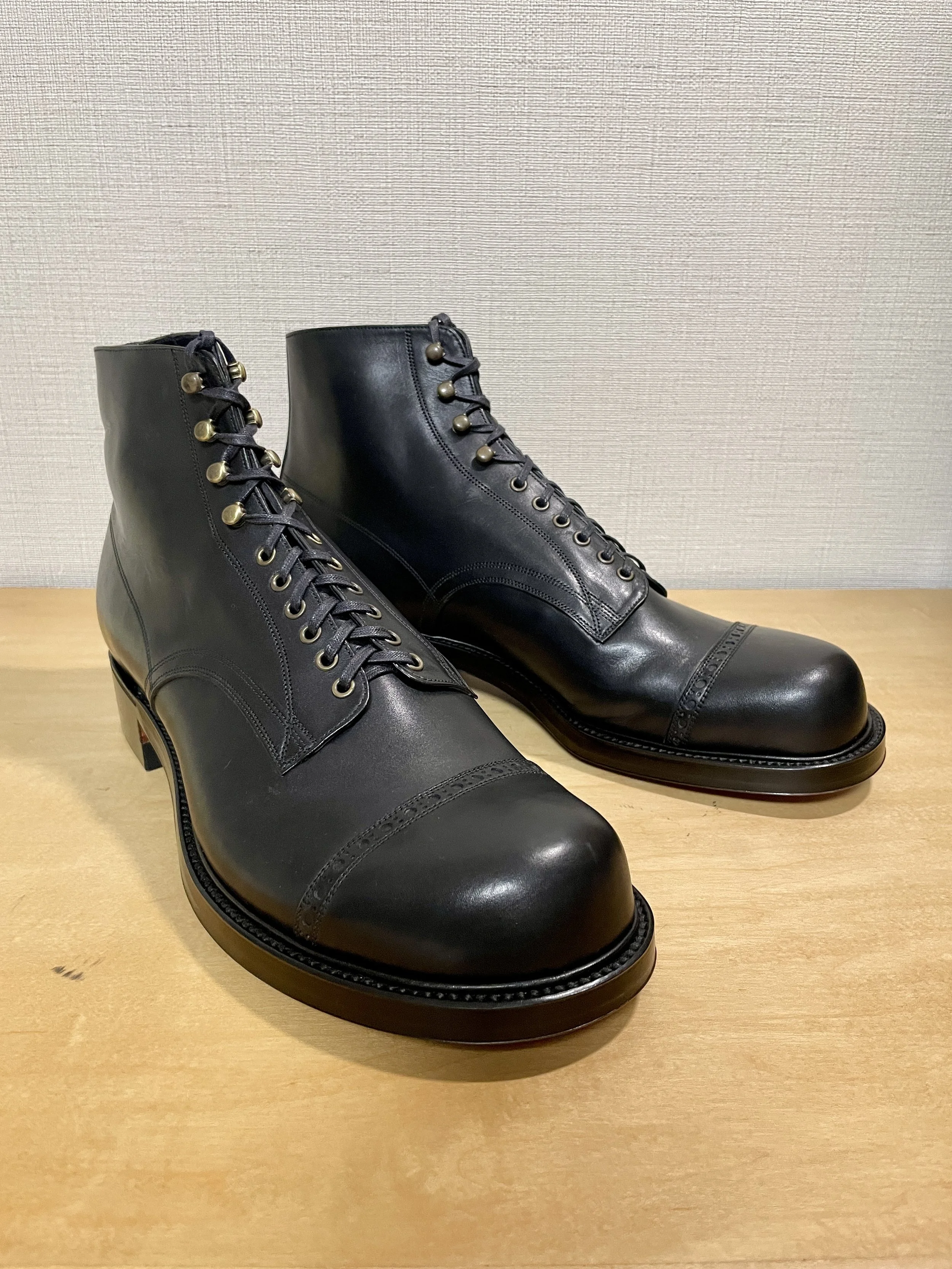 5th Prototype: A three-quarter view showing the relationship between the Munson-influenced toe, long facings, and the overall proportions of the boot.