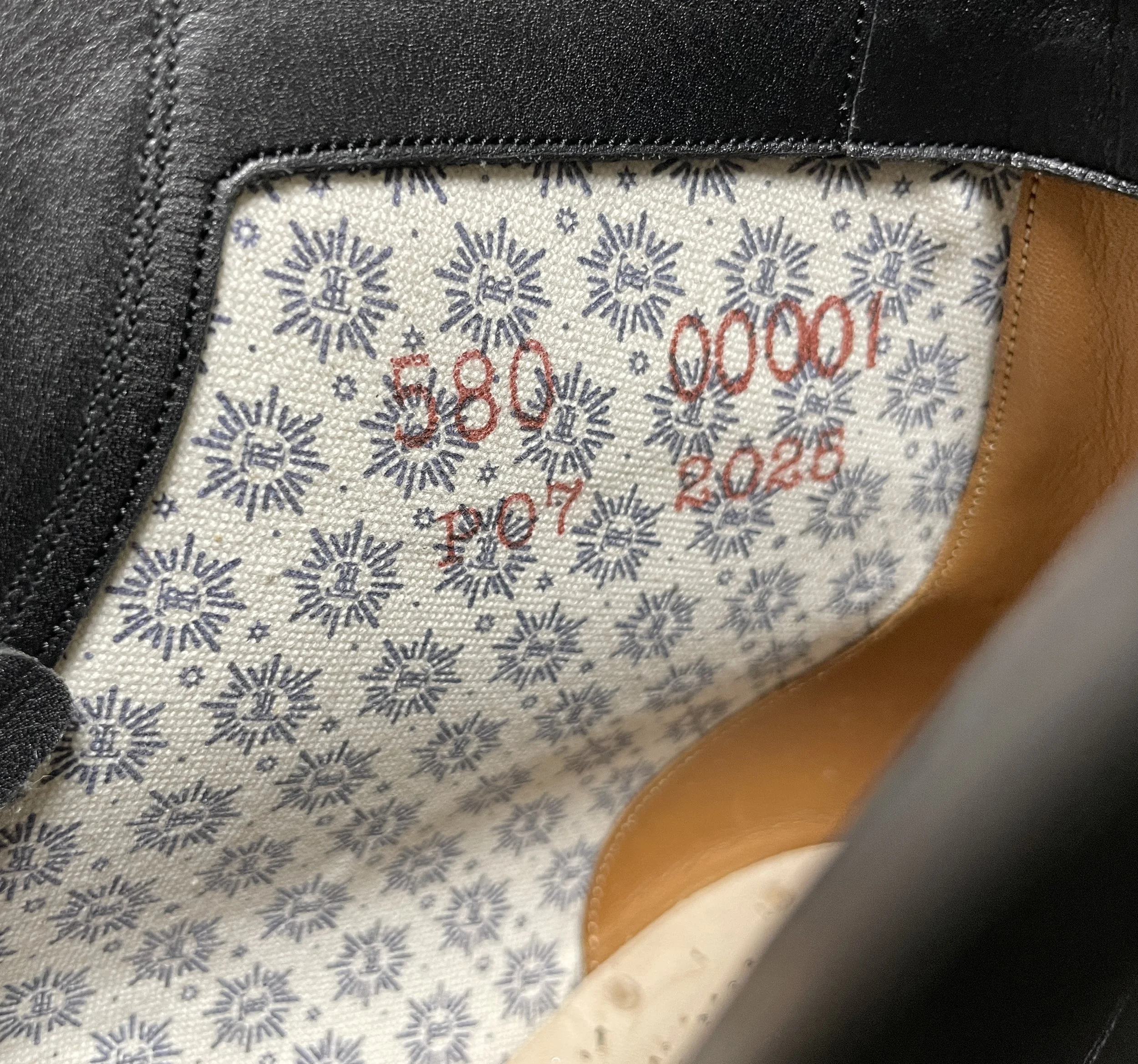 Interior lining detail of the Rustroops Product No. 1 prototype, showing the original lining pattern and prototype marking.