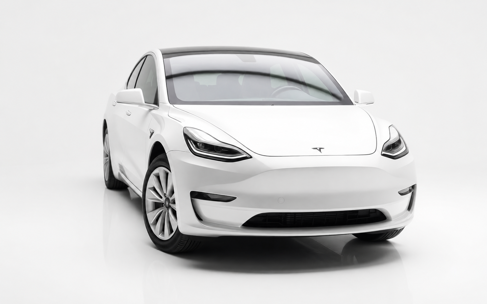 White Tesla Model 3 electric car on a plain white background.