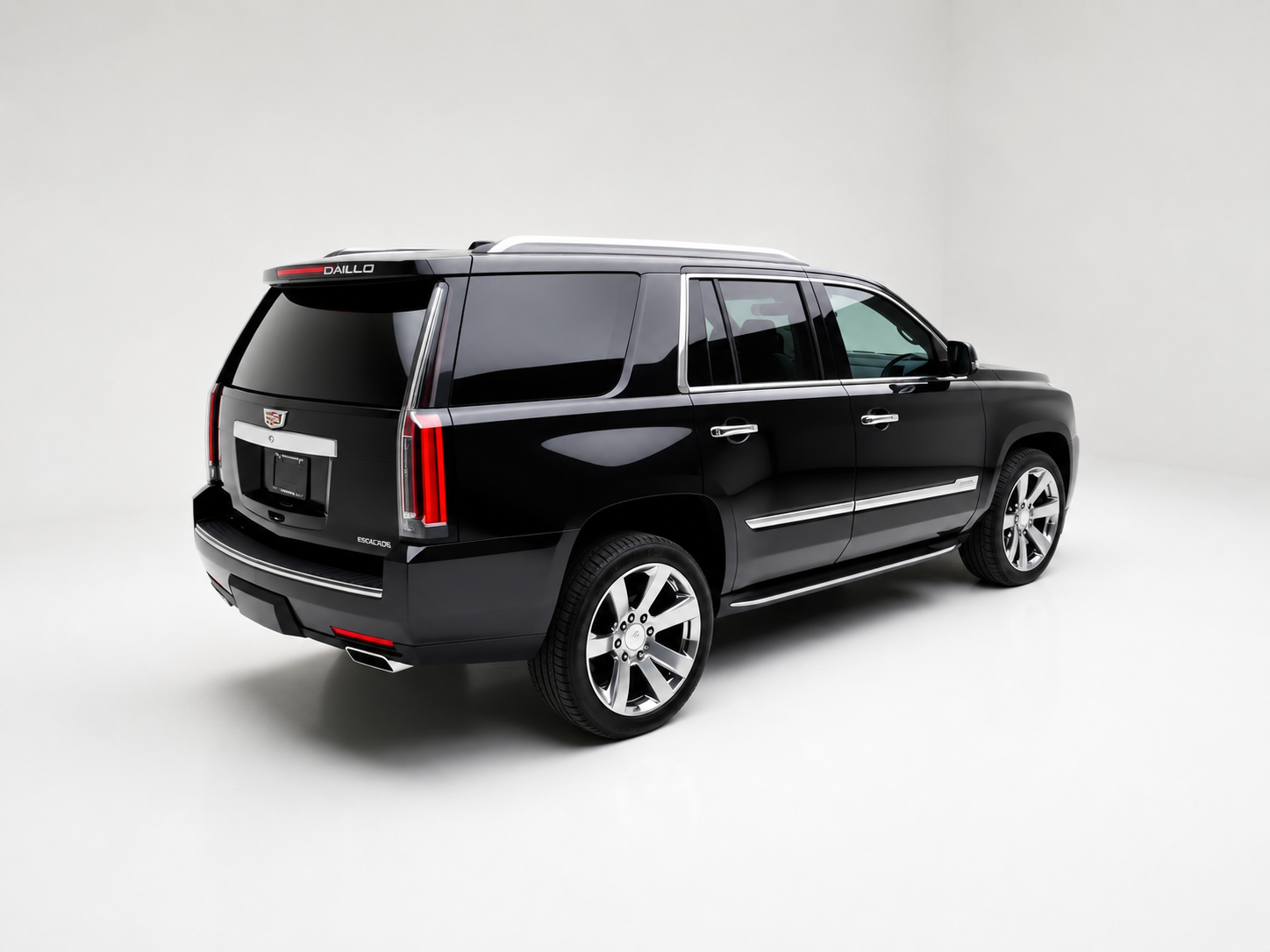 Black Cadillac Escalade SUV with chrome accents, alloy wheels, and tinted windows, presented in a studio with a plain white background.
