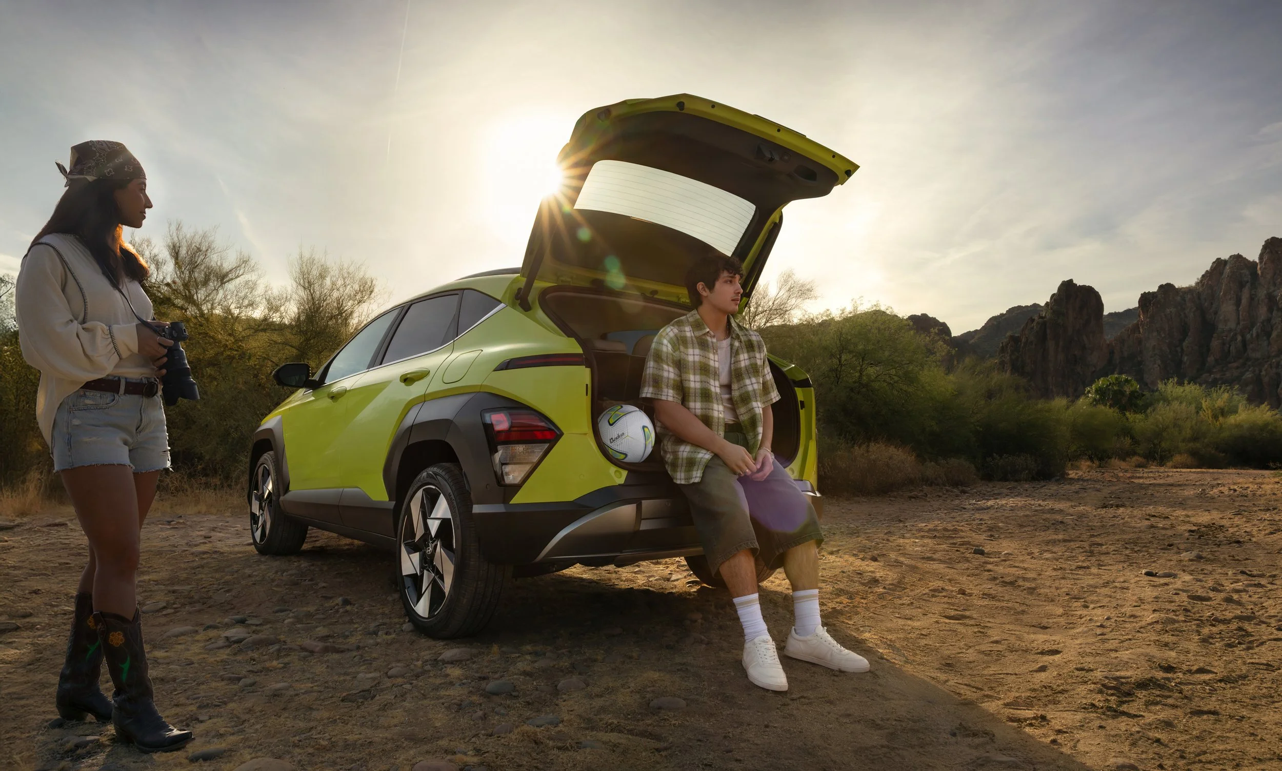 Hyundai KONA commercial lifestyle photography featuring young talent in a desert setting at sunset