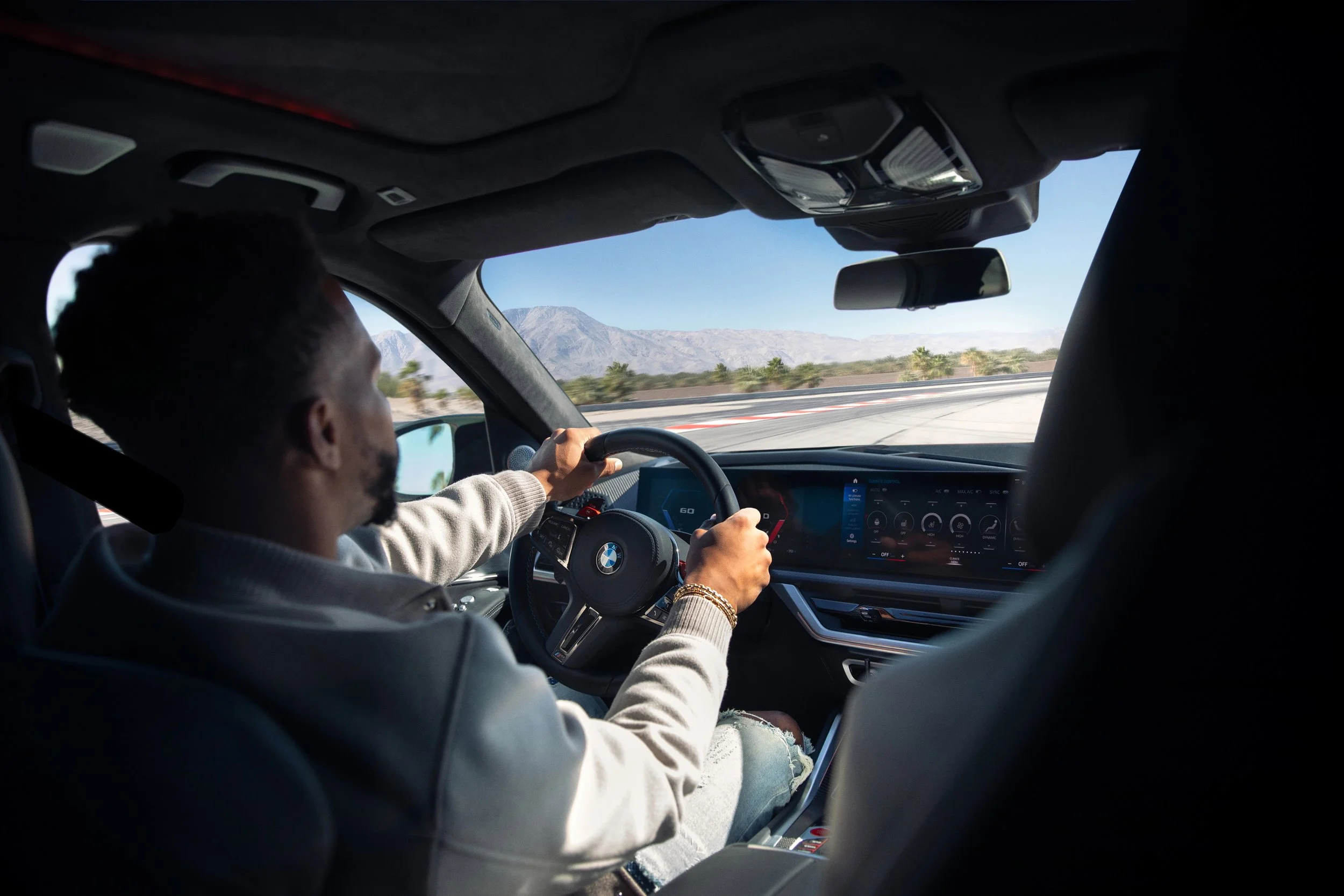 Victor Cruz driving the BMW XM for a celebrity automotive advertising campaign