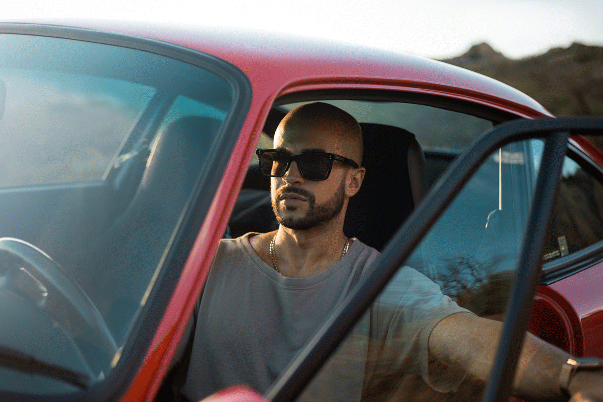 Elegant and emotional commercial automotive lifestyle photography showcasing a couple on an evening drive in Malibu.