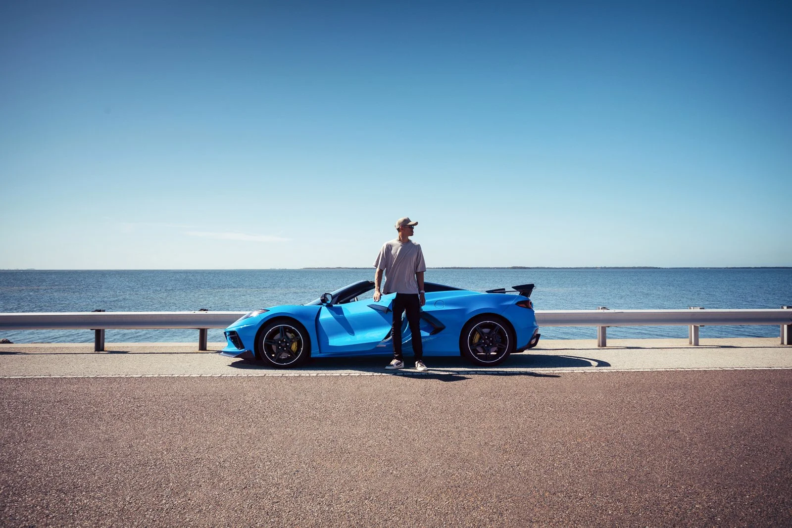 Beautiful and scenic commercial advertising photography of a Corvette Stingray Coupe with natural lighting that emphasizes the vehicle's design language and elegance.