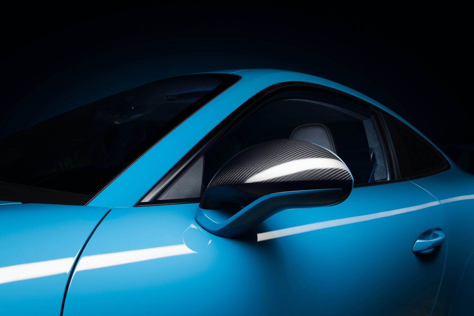Dynamic and dramatic studio advertising photography featuring a Porsche 911 GT3. The series uses forms of lighting to capture the beautiful and elegant design language of the vehicle.