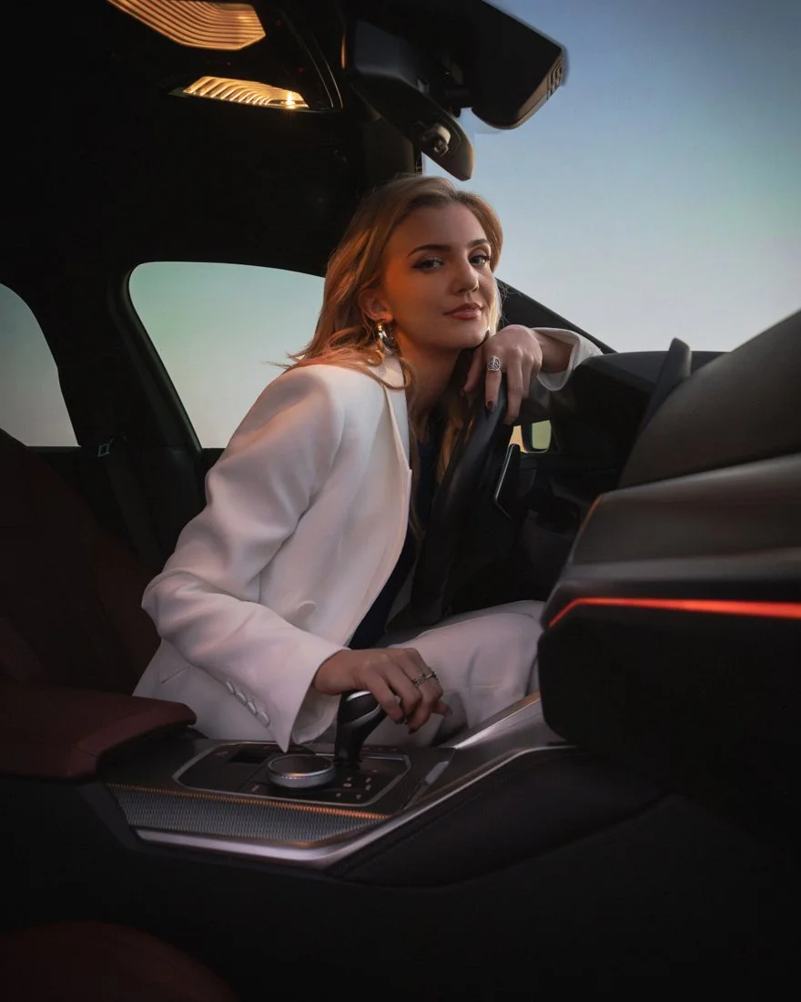 Model sitting in the driver’s seat of a BMW M440i captured for a luxury automotive advertising campaign by a commercial automotive photographer based in Miami and Los Angeles