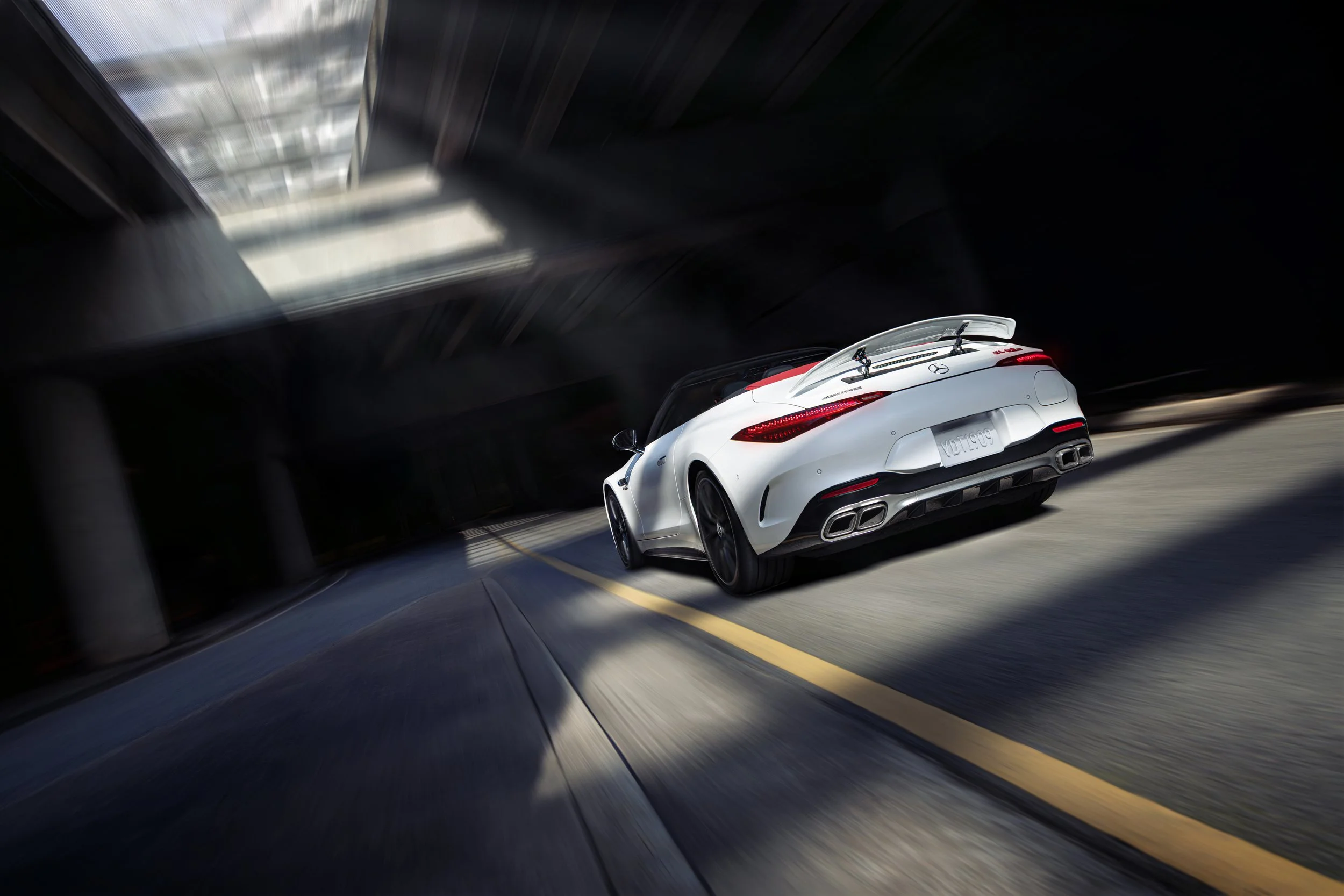 Mercedes-AMG SL driving through an urban environment for a luxury automotive campaign