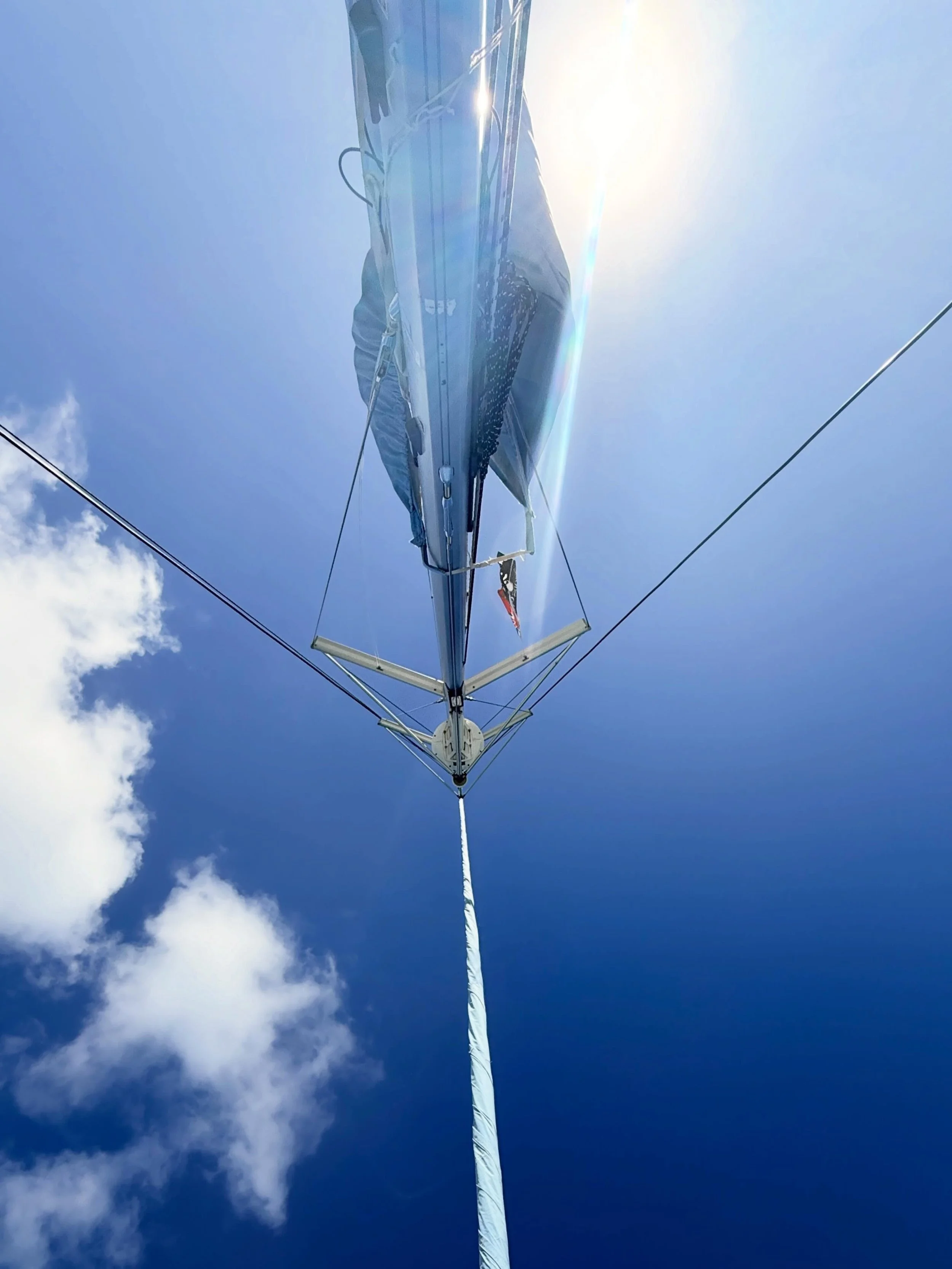 If you are a sailor, you are very familiar with this view. It is one of our favorites - laying down looking at the clouds roll by and contemplating the beauty and wonder of the power of the wind. Where is your favorite spot on a boat to relax?