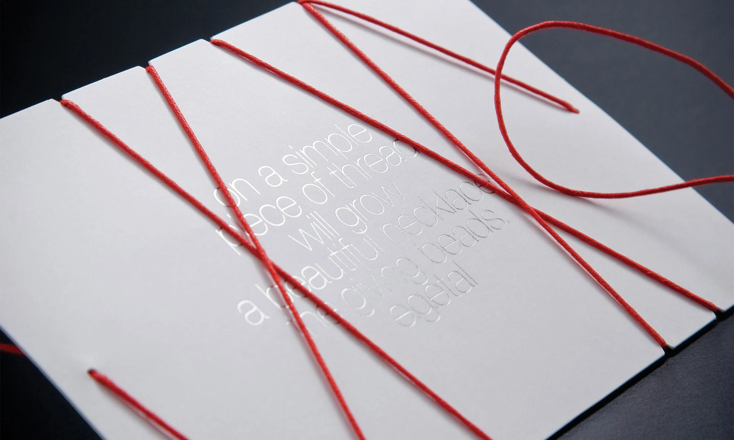  We wanted the invitation to begin the process, starting with the bare thread, to create a sense of anticipation. 