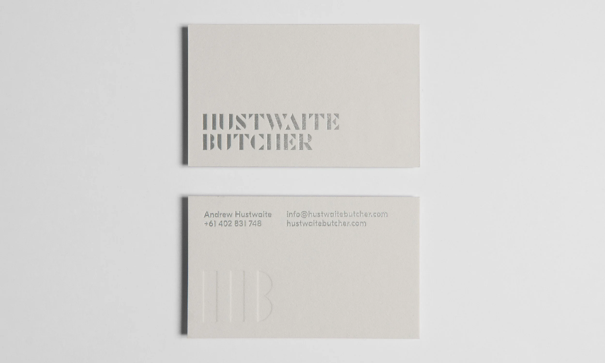   The identity is silver foiled onto a heavy-weight stock, with a blind impression of the makers mark (HB) symbol on the reverse.  