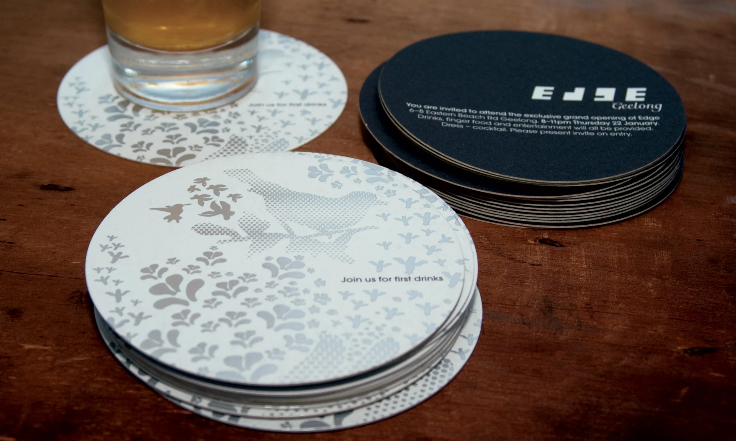  The opening night invitations were created as drink coasters, silver foil on front, print on reverse. 