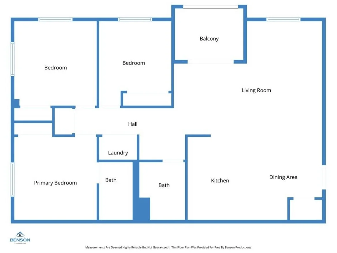 Floor plan of a house showing two bedrooms, primary bedroom, hall, laundry area, two bathrooms, kitchen, dining area, living room, and balcony.