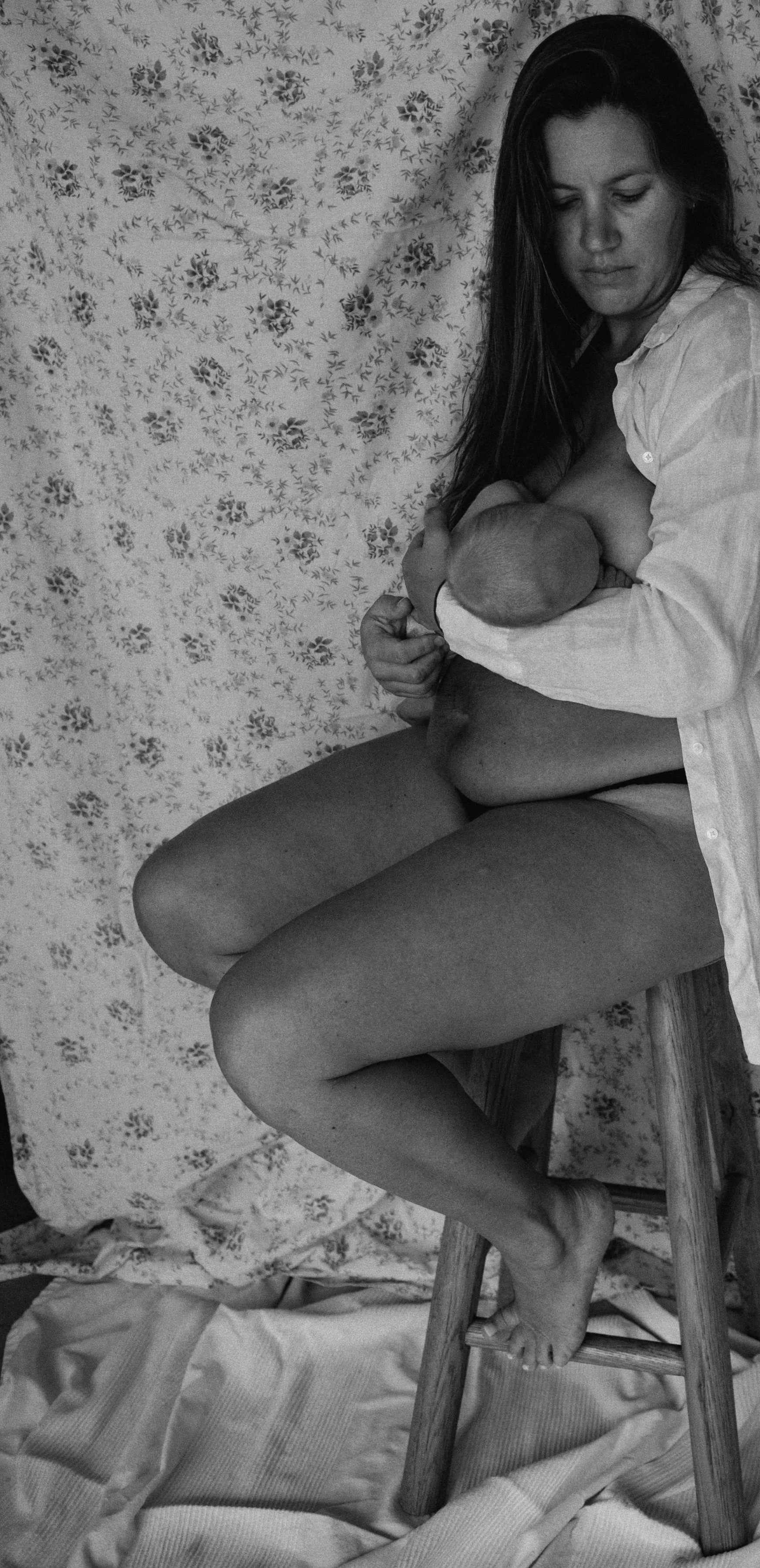 Leila Armour holding her baby during the postpartum period, reflecting the experience of matrescence and the transition into motherhood.