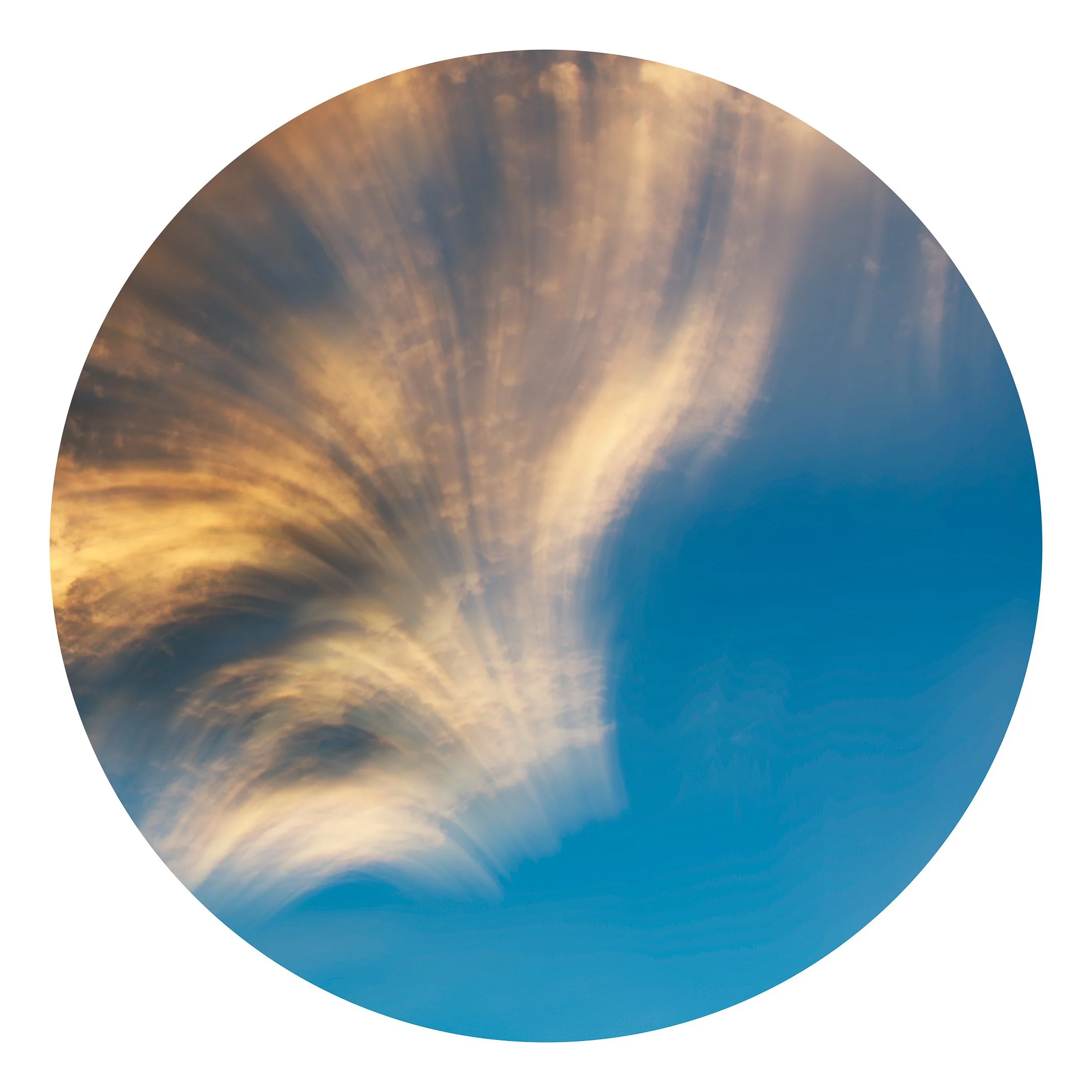 Intentional Camera Movement of clouds during sunset against a blue vibrant sky